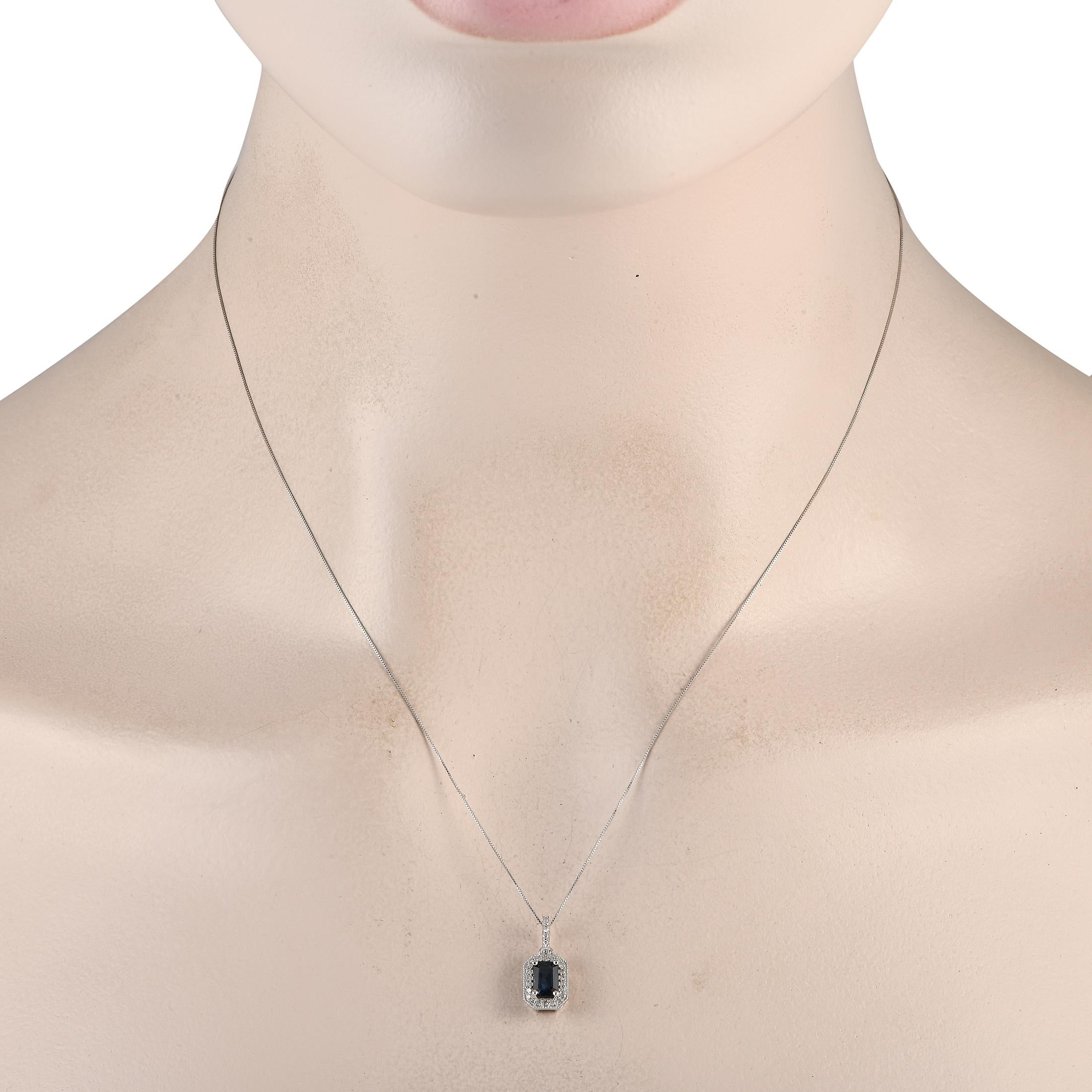 This elegant, understated necklace is simply exquisite in design. Suspended from an 18 chain, youll find an opulent 14K white gold pendant that is adorned with a breathtaking blue sapphire center stone and diamonds totaling 0.10 carats. The pendant