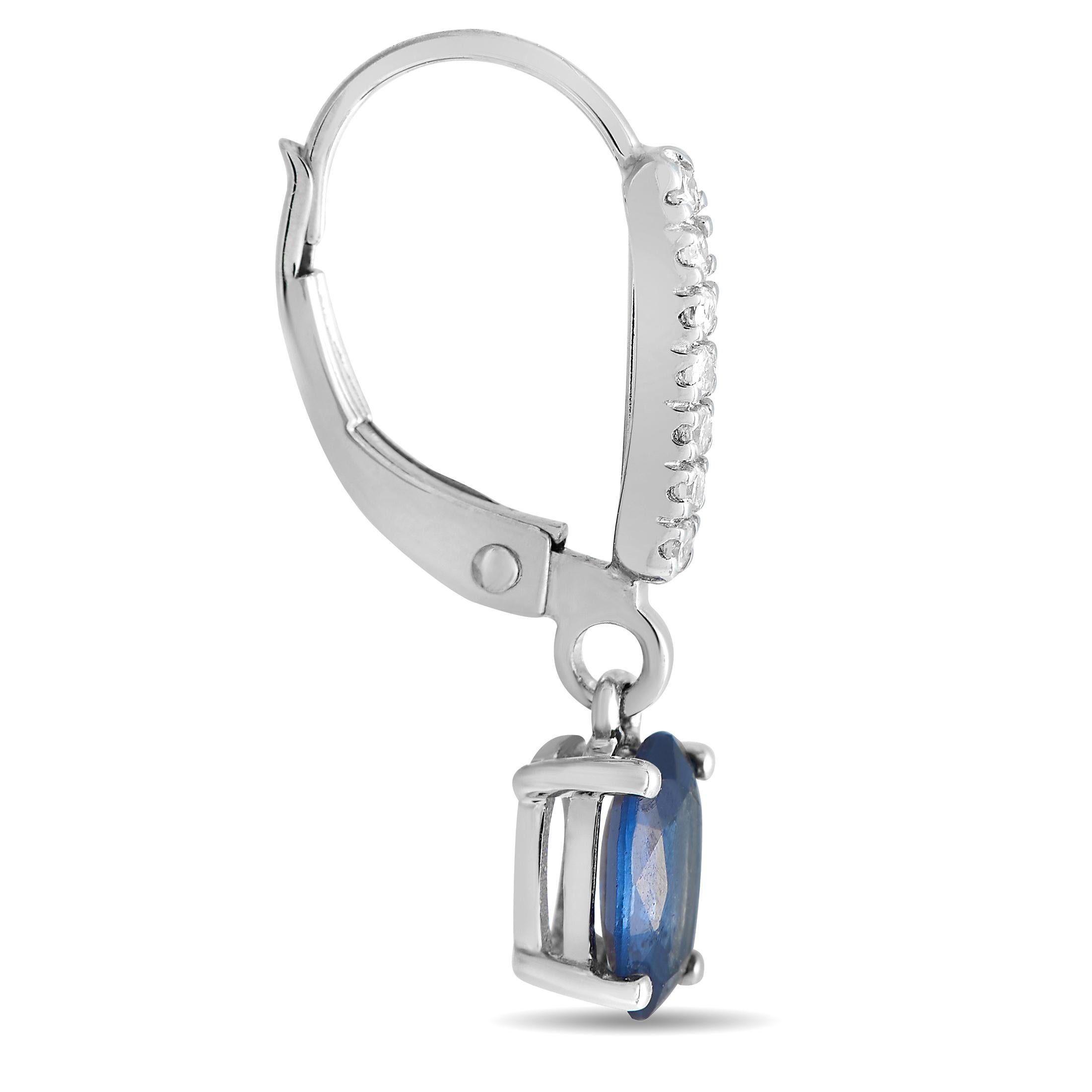 Stunning oval-shaped sapphire gemstones are elevated by sparkling diamond accents totaling 0.10 carats on these impressive luxury earrings. Simple, elegant, and understated, each one features a 14K white gold setting measuring 0.75 long by 0.15