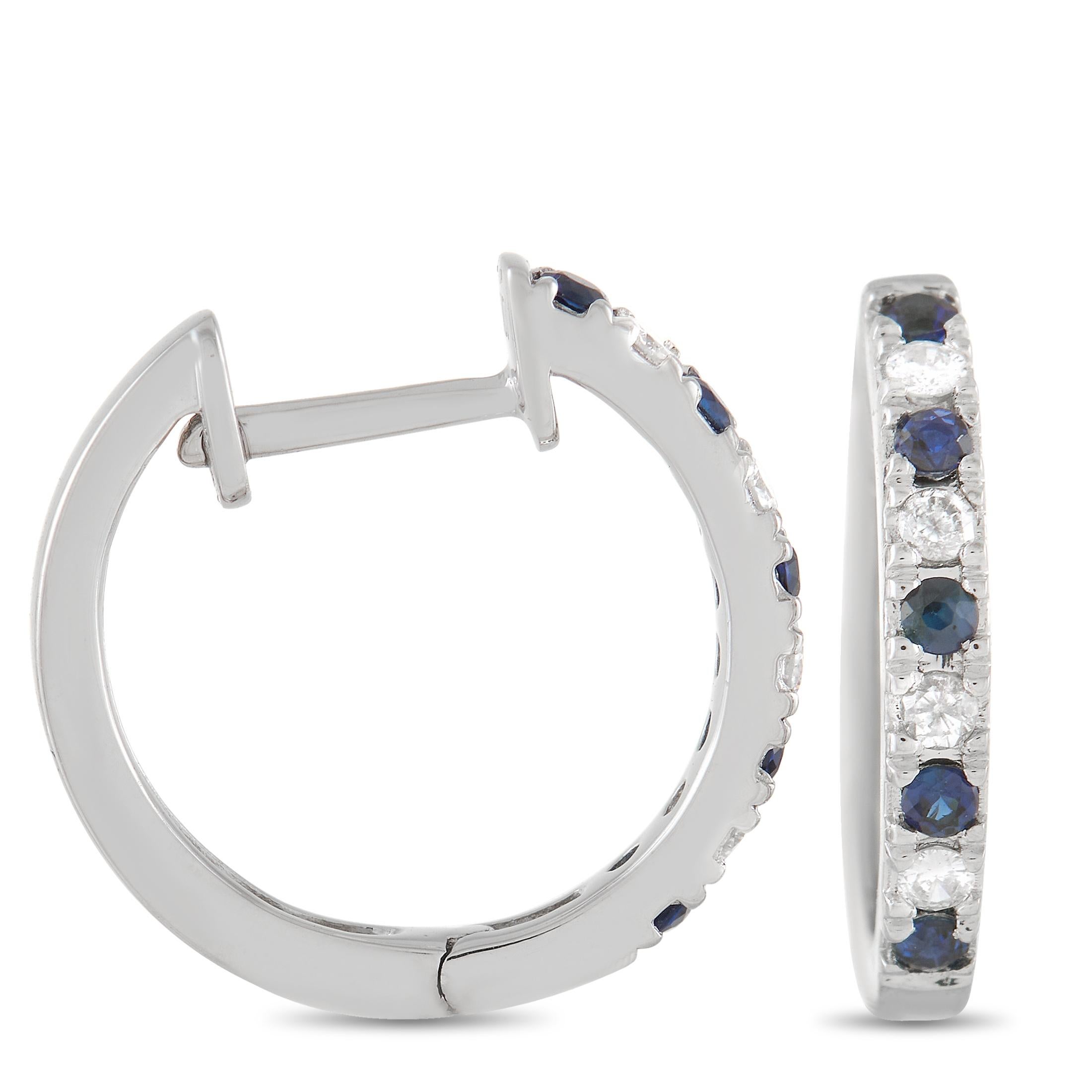 Simple and elegant in design, these 14K White Gold hoops will never go out of style. On each earring, you’ll find a row of alternating diamonds and sapphires that total 0.11 carats and 0.17 carats. Each one measures .5” round and will effortlessly