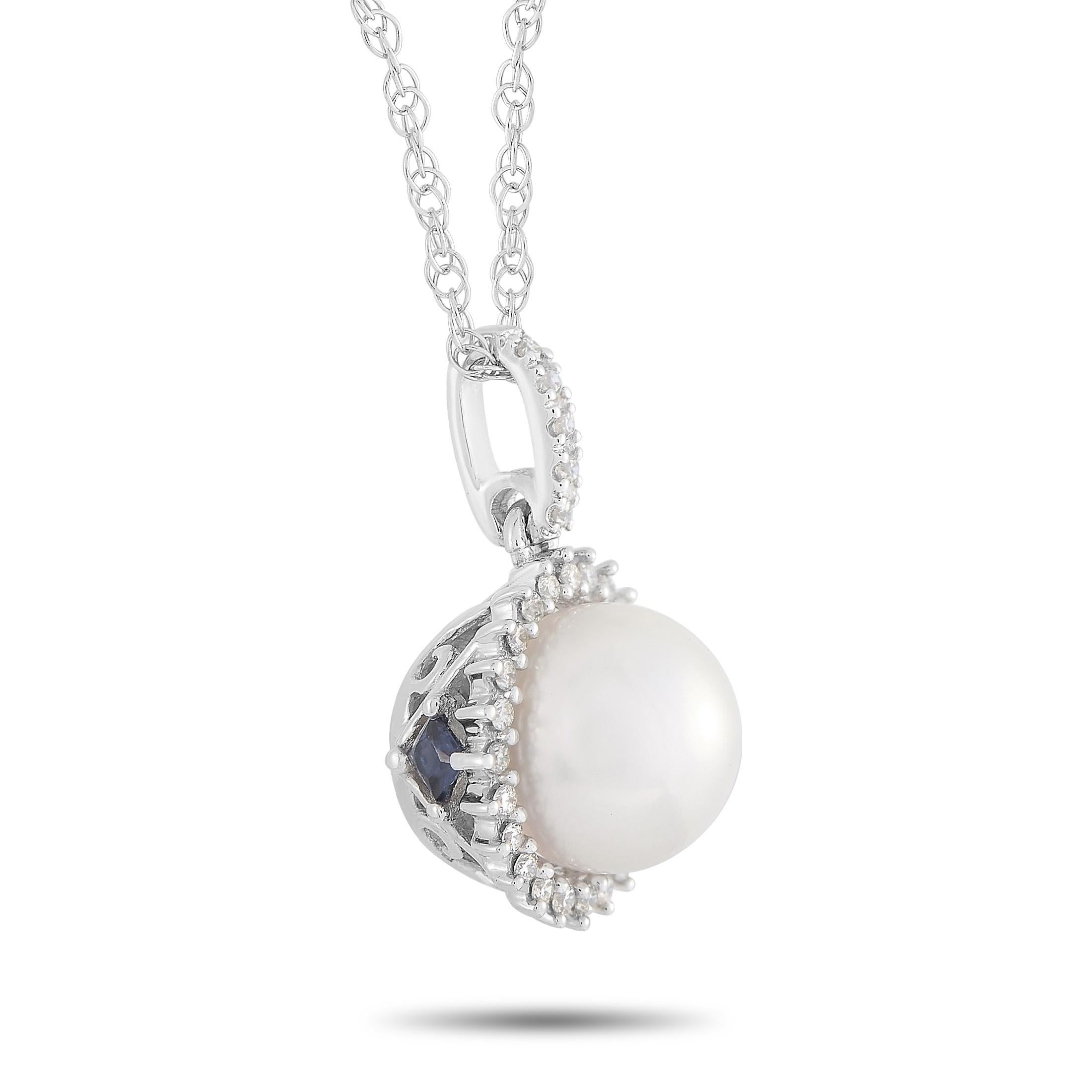 This LB Exclusive 14K White Gold 0.12 ct Diamond and 0.12 ct Sapphire and Pearl Pendant Necklace features a delicate 14K White Gold chain measuring 18 inches in length. The necklace features a round pendant set with 0.12 carats of round-cut