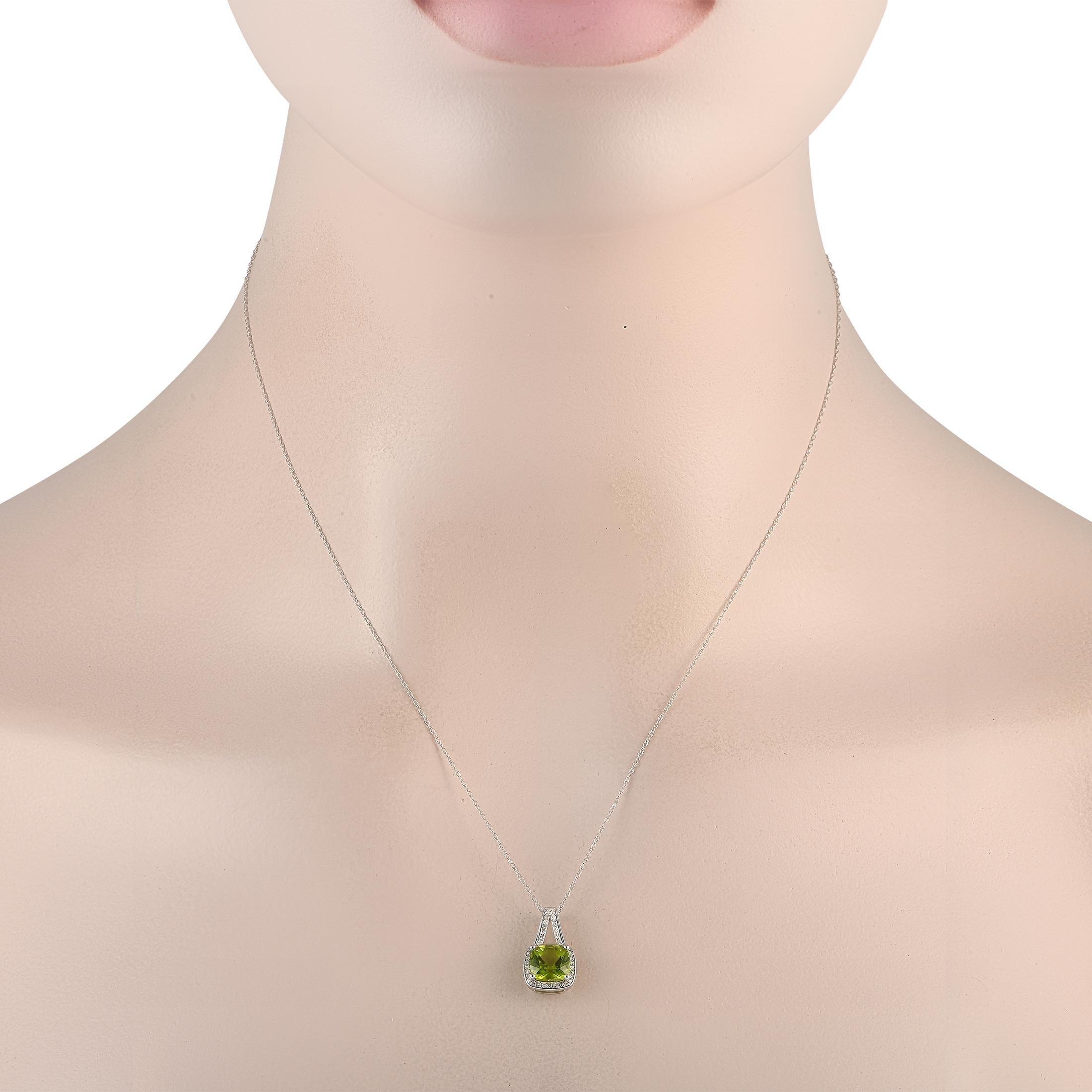 Add some fun to your accessorizing game with this colored gemstone necklace. It features an 18-long double cable chain holding a 0.65 by 0.45 pendant. The pendant held by a diamond-traced split bail has a pillow-shaped peridot glowing exquisitely