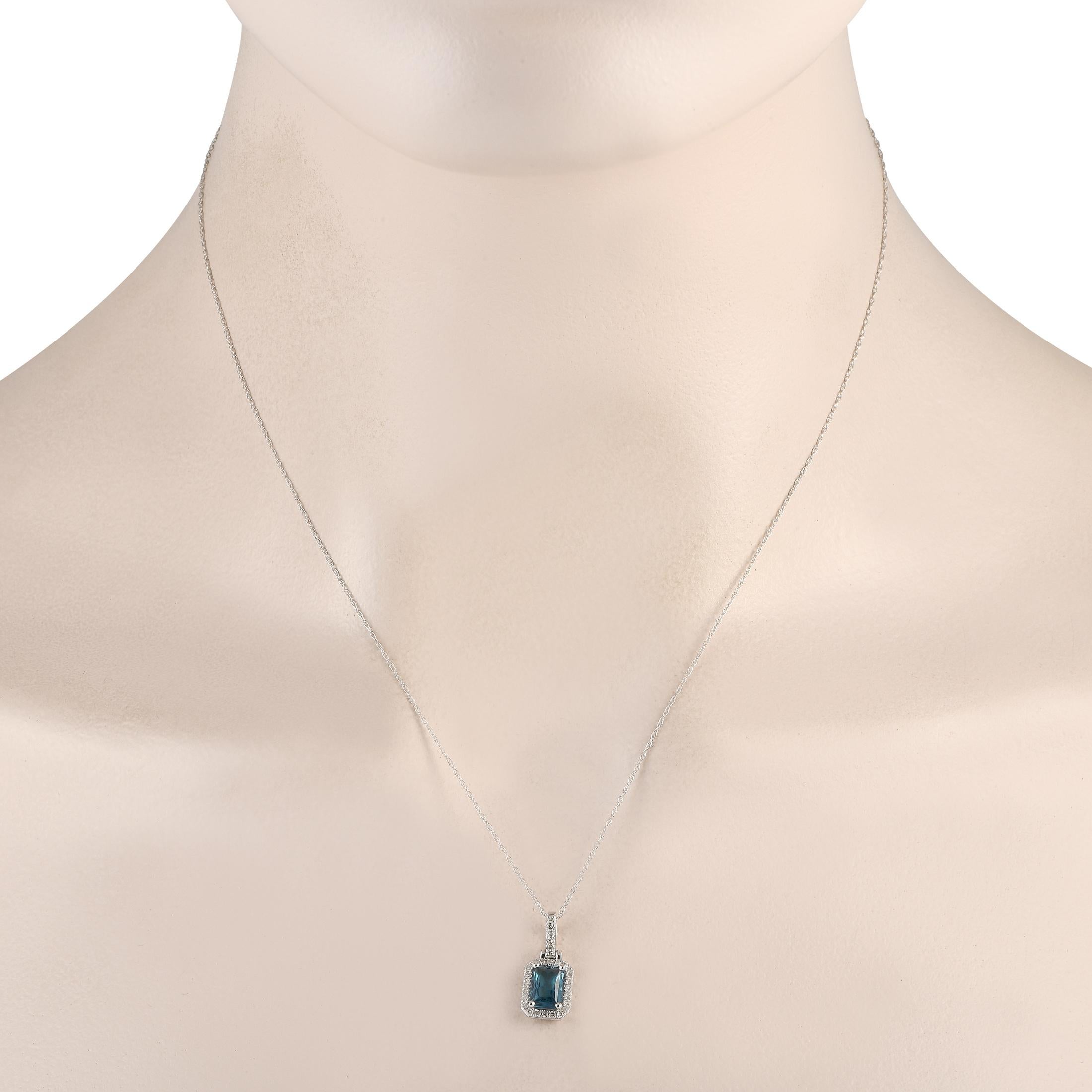 A captivating Blue Topaz gemstone is surrounded by a halo of diamonds totaling 0.12 carats on this impeccably crafted necklace. Suspended from an 18 chain, this pieces 14K White Gold pendant measures 0.65 long by 0.30 wide.This jewelry piece is