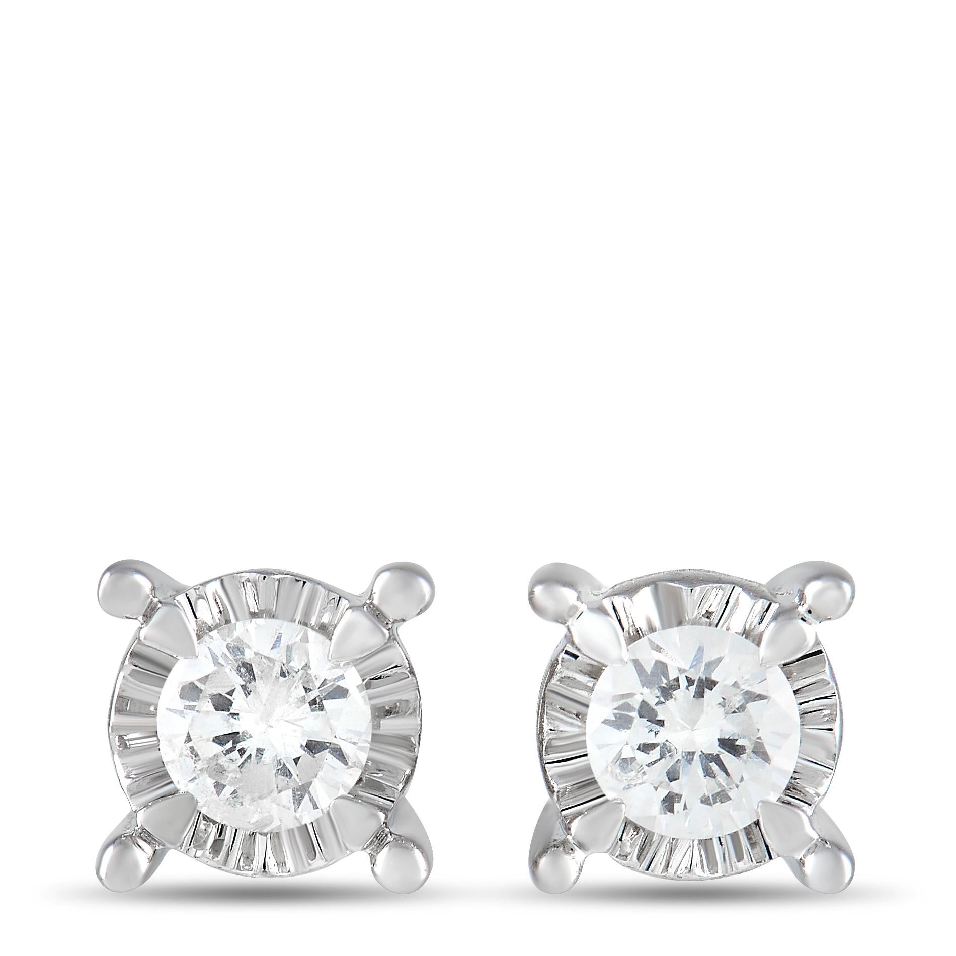 Made with diamonds that together possess a total weight of 0.13 carats, these simple earrings are an effortless way to add a touch of luxury to any occasion. A textured 14K White Gold setting adds extra visual impact to these delicate earrings,