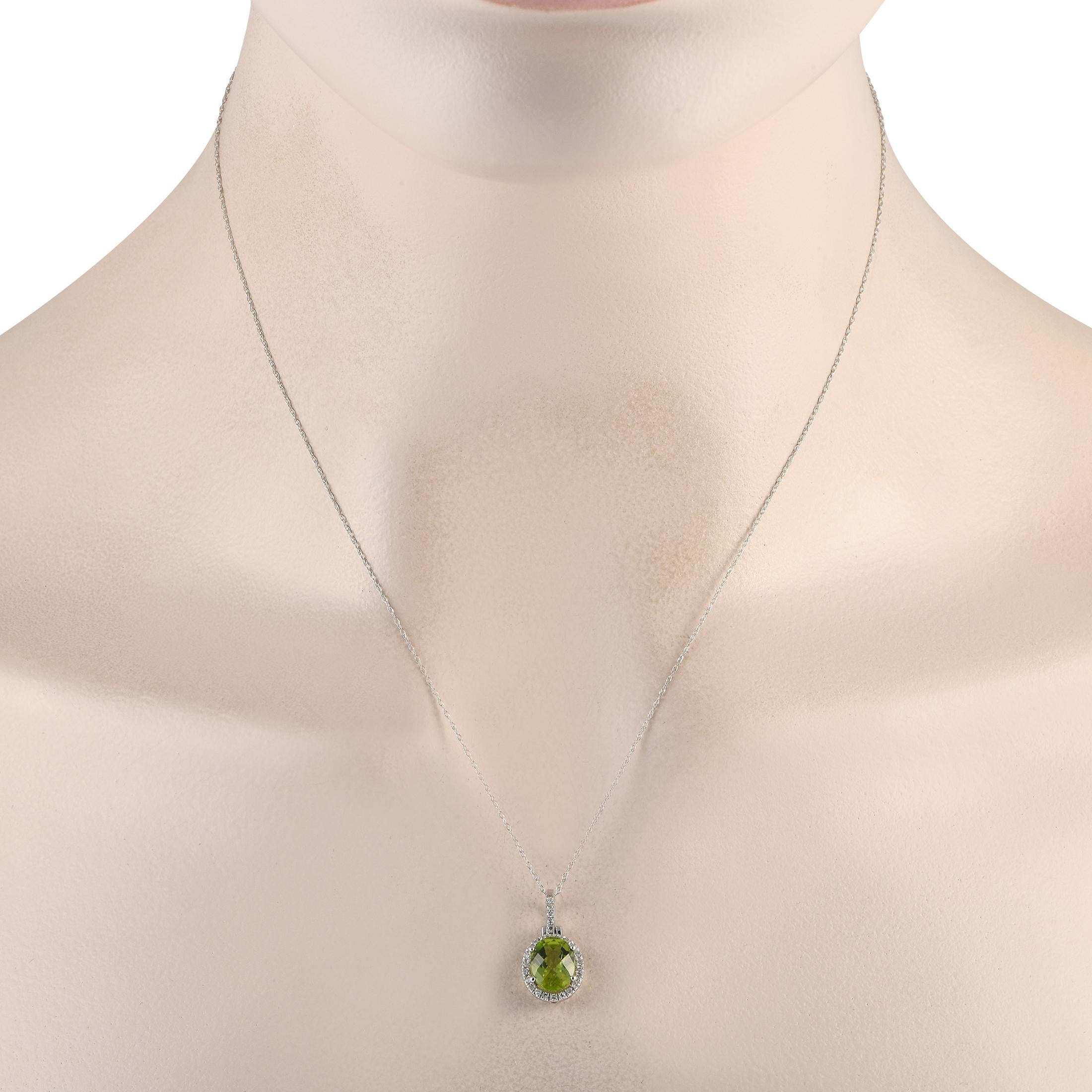 A splash of color and a shimmering sparkle are what you can expect from this LB Exclusive piece. The necklace is crafted in 14K white gold and measures 18 long. The pendant measures 0.75 by 0.45 and is decorated with an oval peridot haloed by tiny