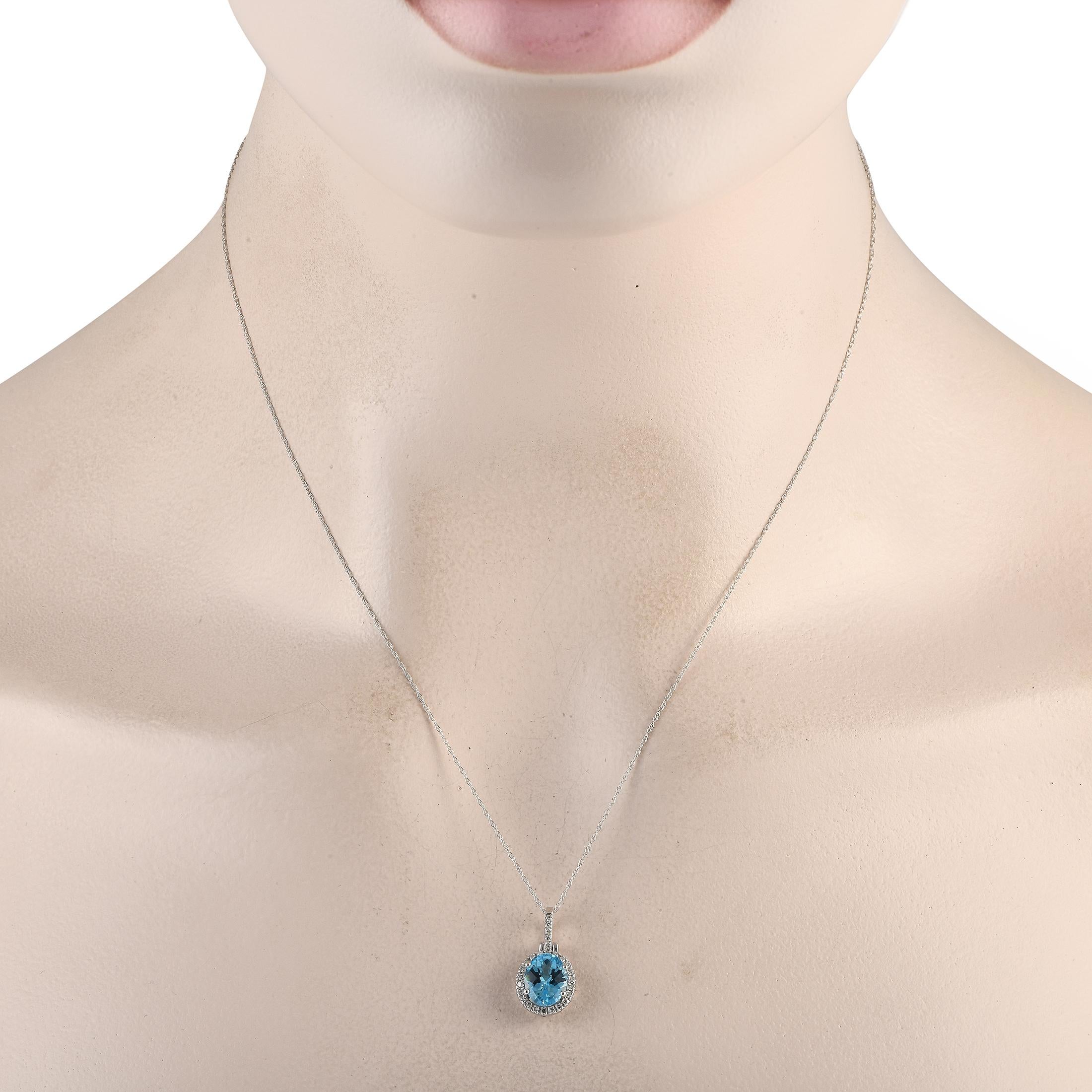 This luxury necklace is a timeless piece that will continually impress. Suspended from a delicate 18 chain, youll find a simple, elegant pendant measuring 0.75 long by 0.45 wide. Its elevated by a breathtaking blue topaz center stone and diamond