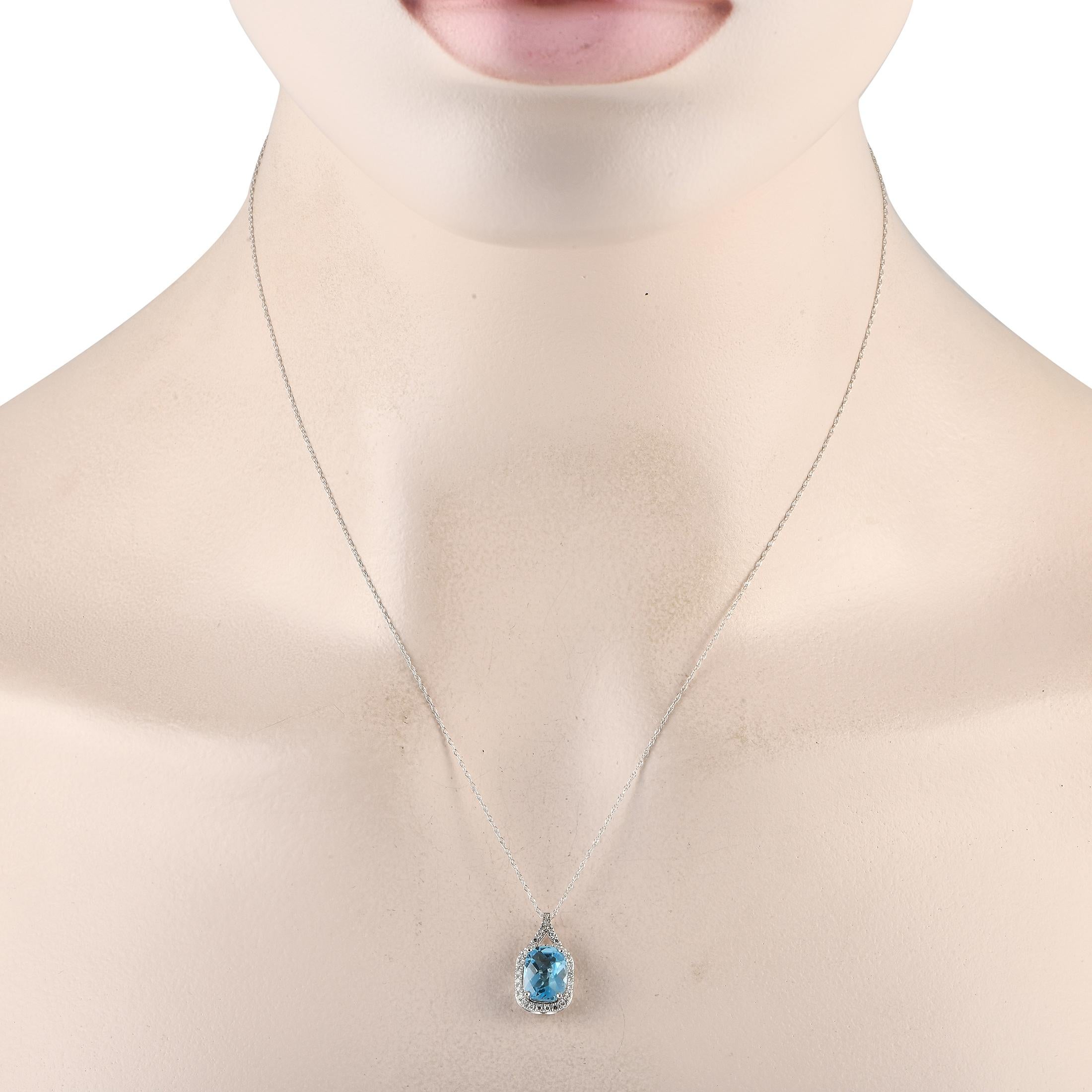 A brilliant blue Blue Topaz gemstone makes a statement on this impeccably crafted luxury necklace. This pieces pendant is crafted from 14K White Gold and measures 0.75 long by 0.45 wide. Its suspended from an 18 chain and includes sparkling Diamond