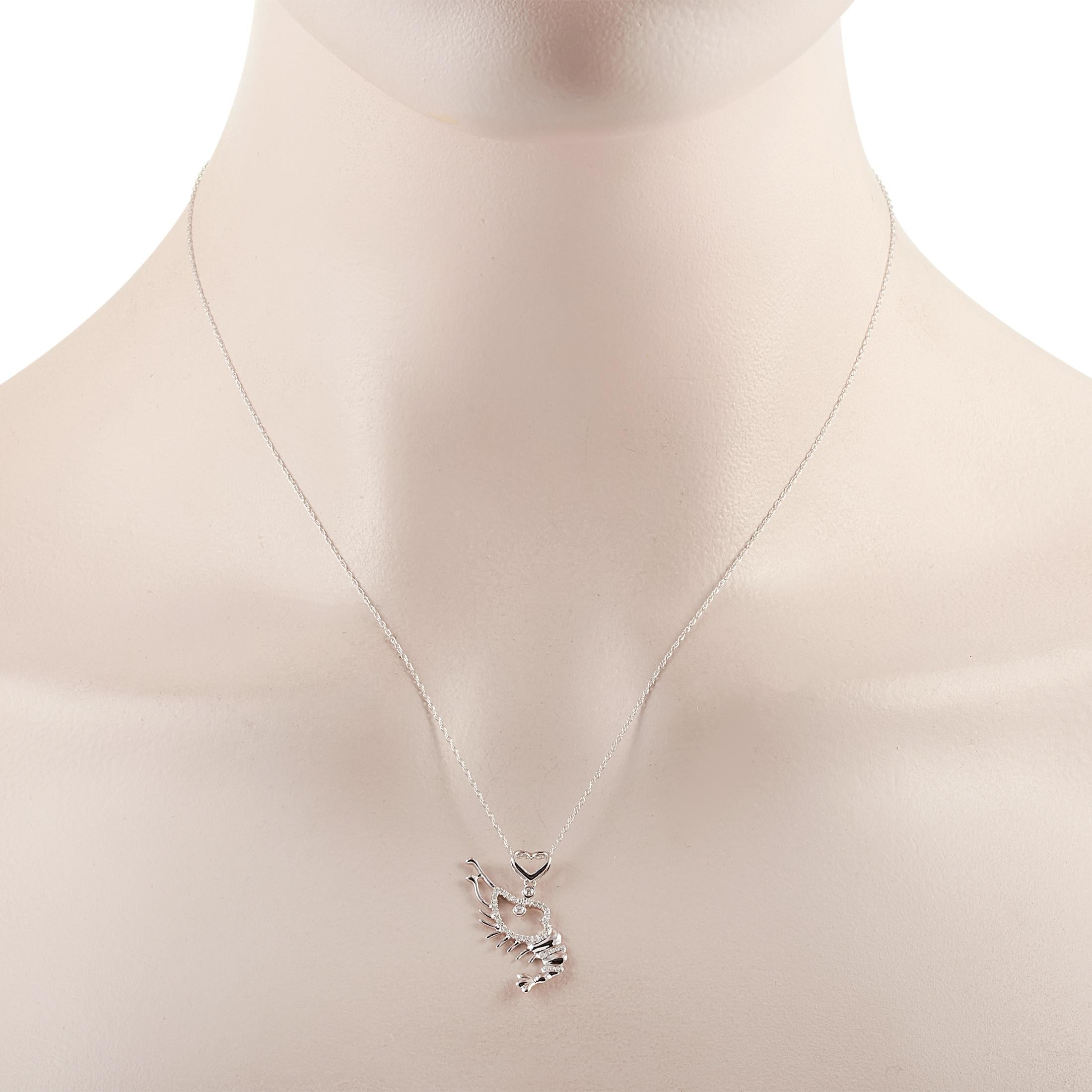 This LB Exclusive necklace is made of 14K white gold and embellished with diamonds that amount to 0.14 carats. The necklace weighs 1.9 grams and boasts a 16” chain and a pendant that measures 1” in length and 0.50” in width.
 
 Offered in brand new