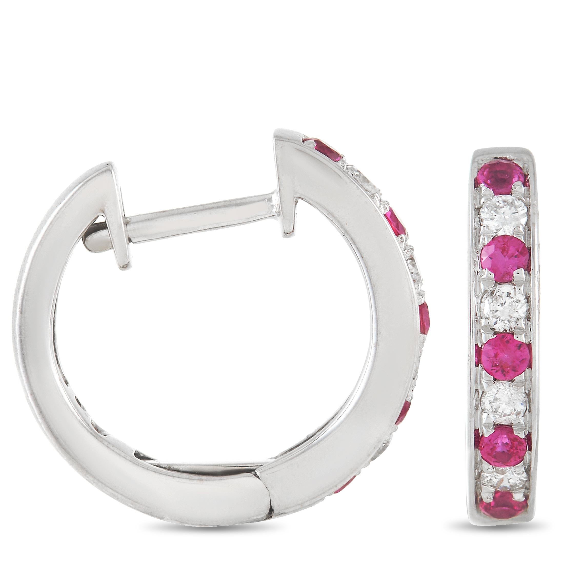 These glamourous LB Exclusive 14K White Gold 0.15 ct Diamond 0.25 ct Ruby Hoop Earrings are made with 14K white gold and are set with 0.15 carats of round-cut diamonds and 0.25 carats of round cut rubies set in a single row along the face of each