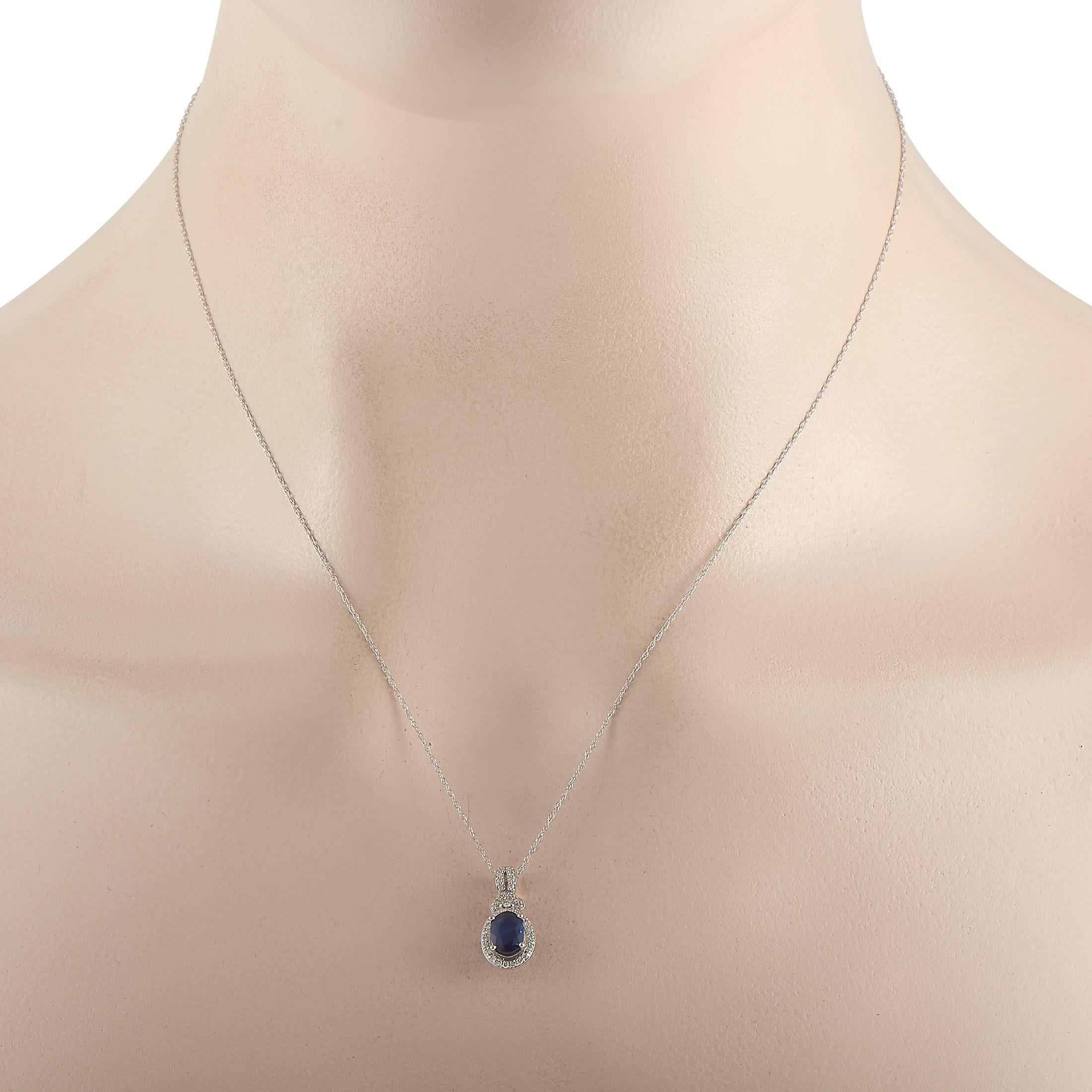 This gorgeous LB Exclusive 14K White Gold 0.15 ct Diamond and Sapphire Pendant Necklace includes a delicate 14K White Gold chain that measures 17 inches in length and features a spring ring closure. The necklace includes a matching 14K oval pendant