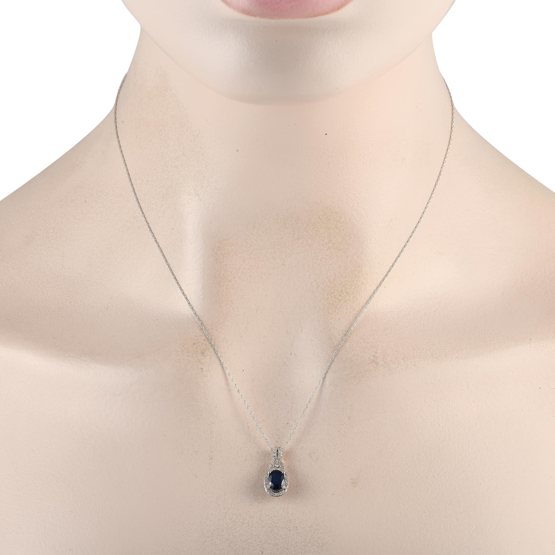 This necklace is a luxury piece that is ideal for any occasion. Sleek and elegant, the 14K white gold pendant measures 0.75 long by 0.35 wide and is suspended from a delicate 18 chain. Sparkling diamonds with a total weight of 0.15 carats
