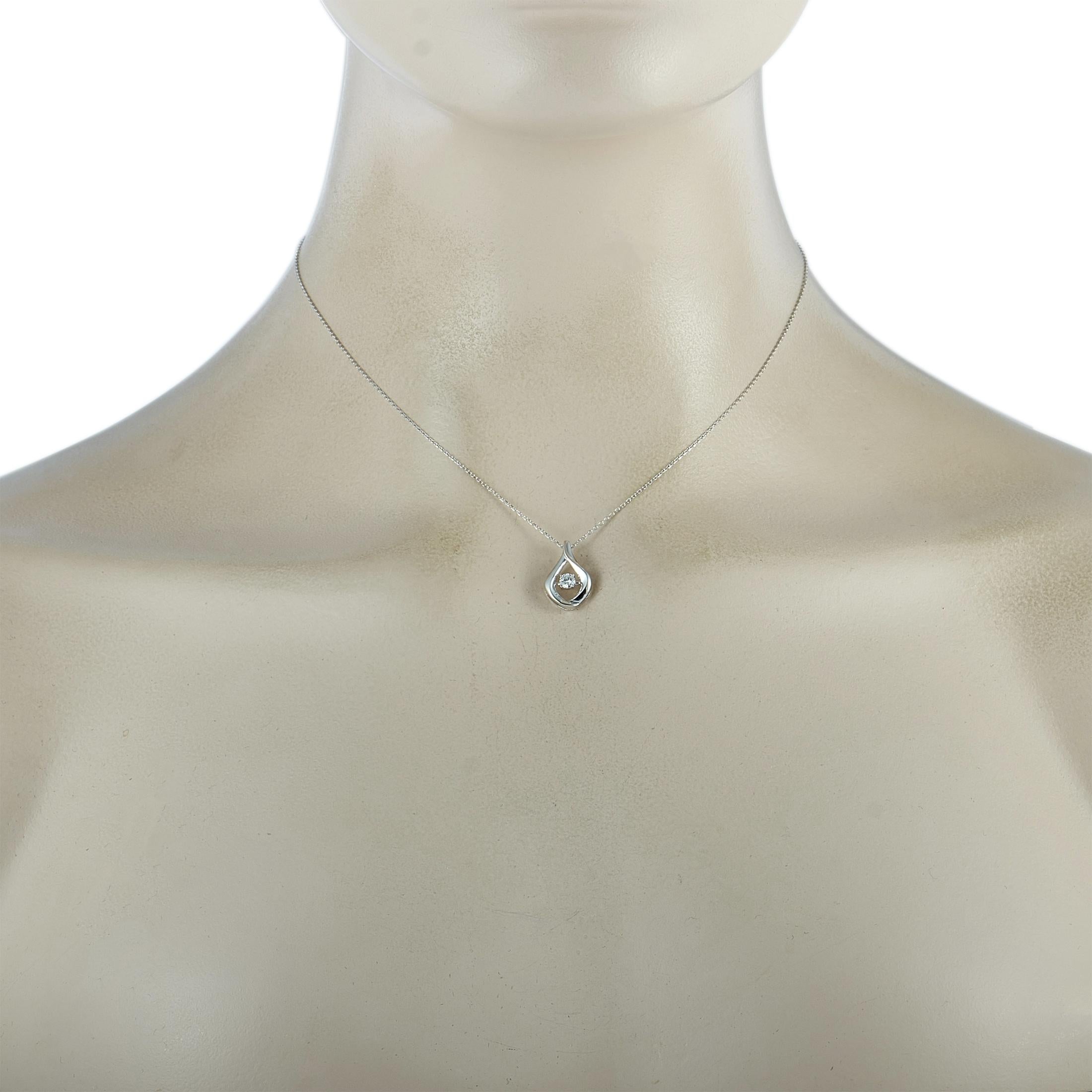 This LB Exclusive necklace is crafted from 14K white gold and weighs 2.3 grams. It is presented with a 15” chain and a pendant that measures 0.62” in length and 0.40” in width. The necklace is set with a diamond stone that weighs 0.15 carats.
 
