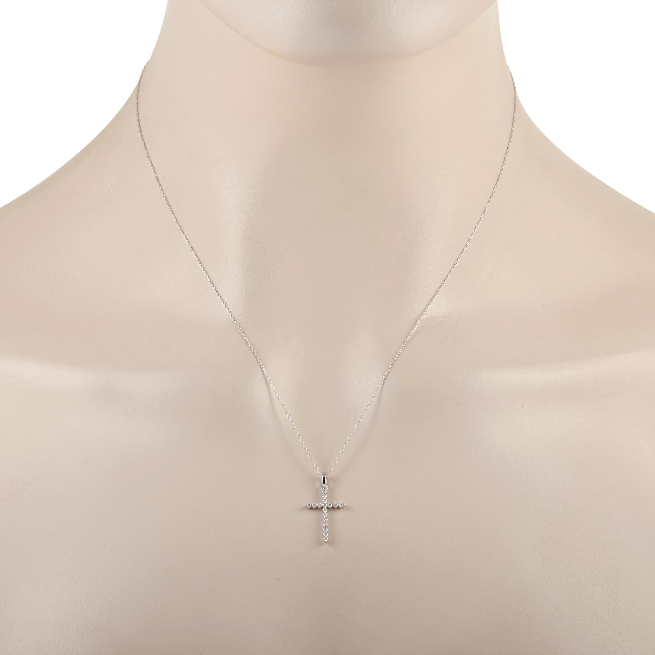 Keep it simple and stylish with this striking pendant necklace. A 14K White Gold setting provides the perfect foundation for this piece’s cross shaped pendant, which measures .88” long and .44” wide. It’s crafted entirely from shimmering round cut
