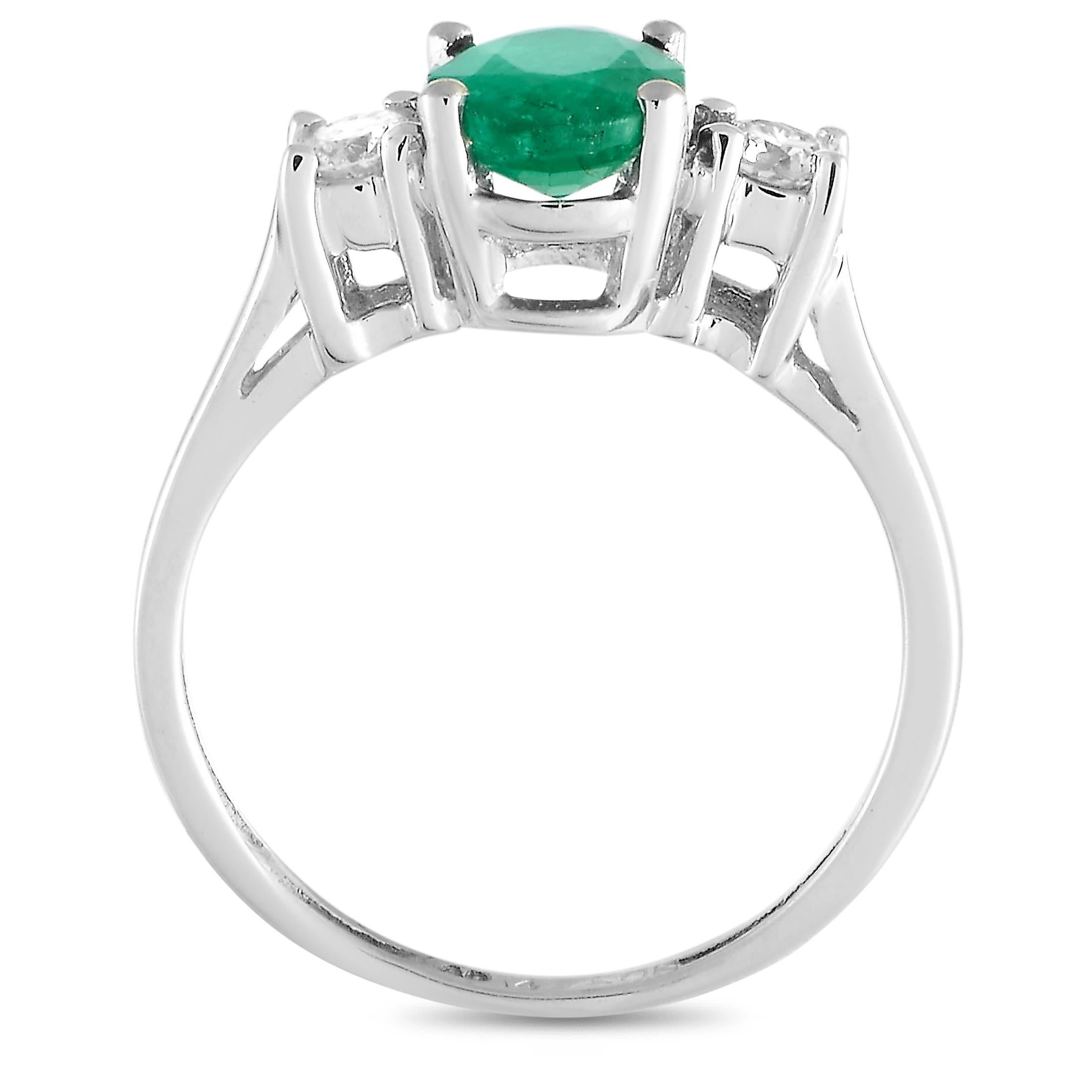 This LB Exclusive ring is made of 14K white gold and embellished with an emerald and a total of 0.20 carats of diamonds. The ring weighs 2.5 grams and boasts band thickness of 2 mm and top height of 6 mm, while top dimensions measure 8 by 13 mm.
