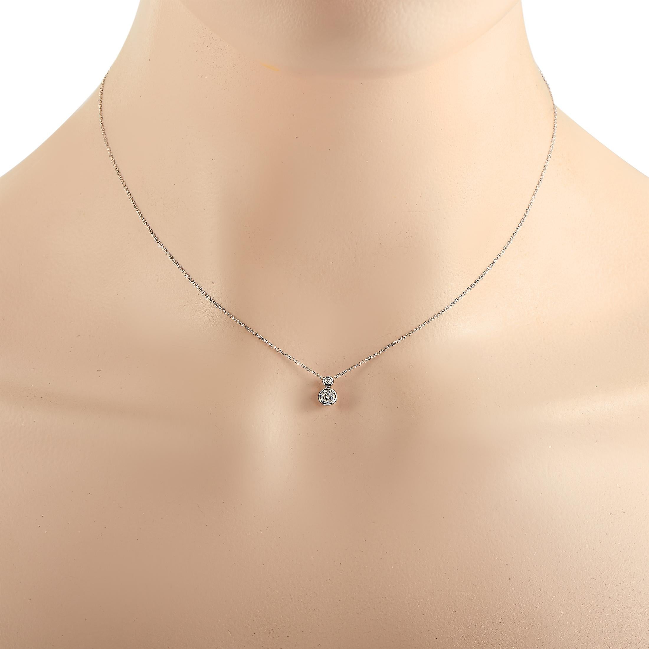 This LB Exclusive necklace is crafted from 14K white gold and weighs 1.4 grams. It is presented with a 16” chain and a pendant that measures 0.31” in length and 0.25” in width. The necklace is embellished with diamonds that total 0.20 carats.
 
