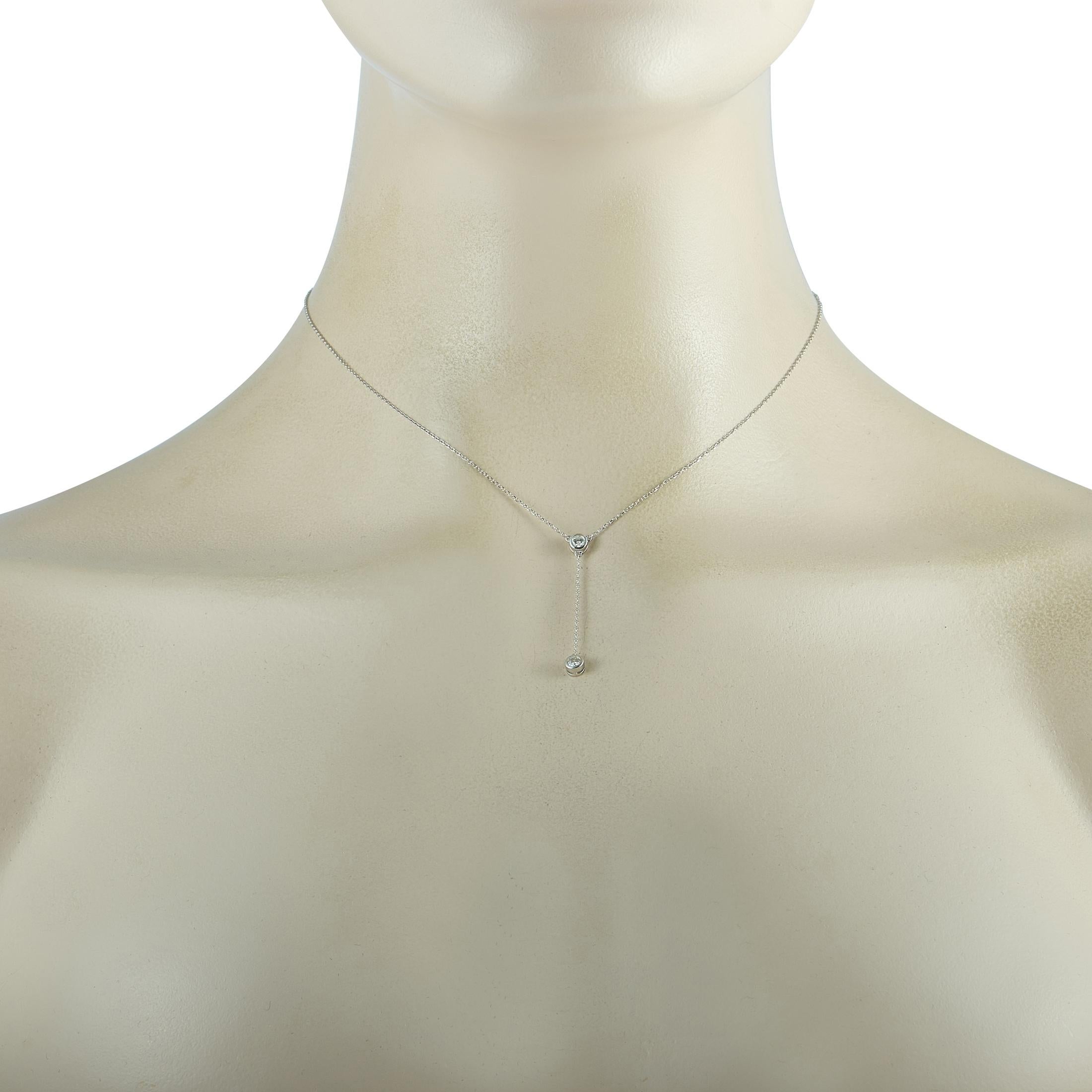 This LB Exclusive necklace is crafted from 14K white gold and weighs 1.7 grams. It is presented with a 15” chain and a pendant that measures 1.45” in length and 0.15” in width. The necklace is embellished with diamonds that total 0.20 carats.
 
