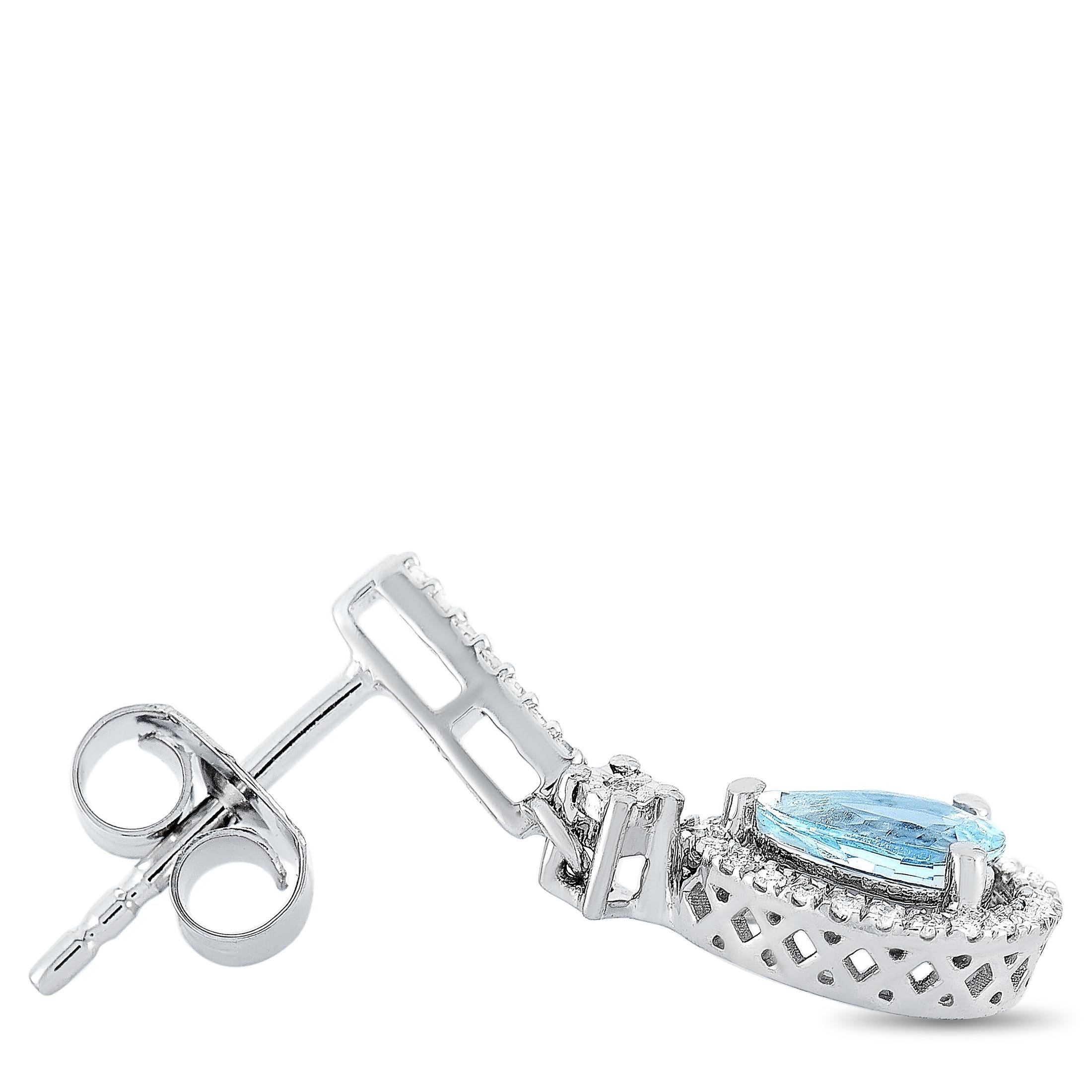 These LB Exclusive earrings are made of 14K white gold and each of the two weighs 1.25 grams. They measure 0.8 in length and 0.25 in width. The pair is embellished with diamonds and aquamarines that total 0.20 carats.The earrings are offered in