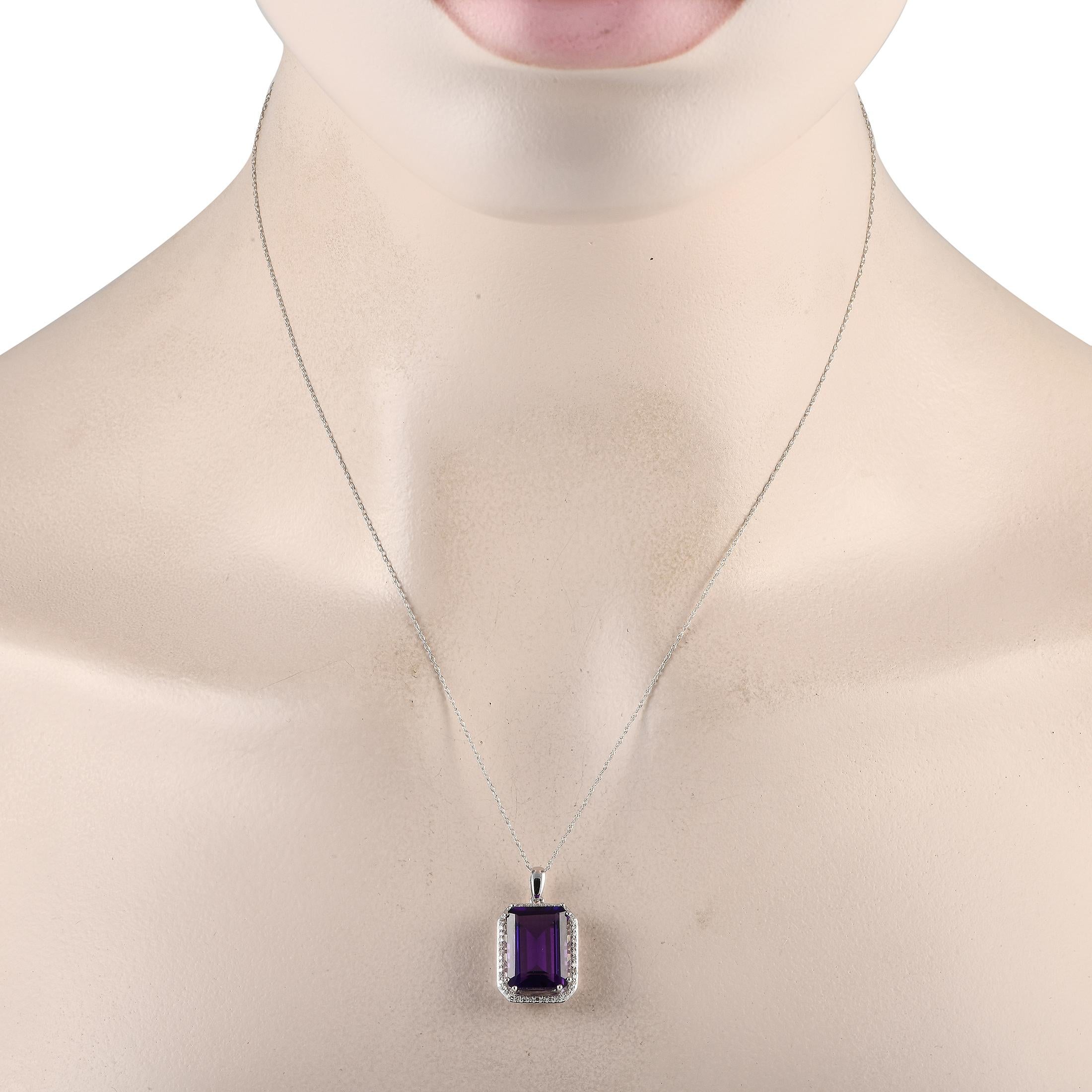 A bold Amethyst gemstone serves as a stunning focal point on this elegant necklace. Crafted from 14K White Gold, this pieces pendant measures 1.0 long by 0.50 wide and is suspended from a delicate 18 chain. Sparkling Diamonds with a total weight of