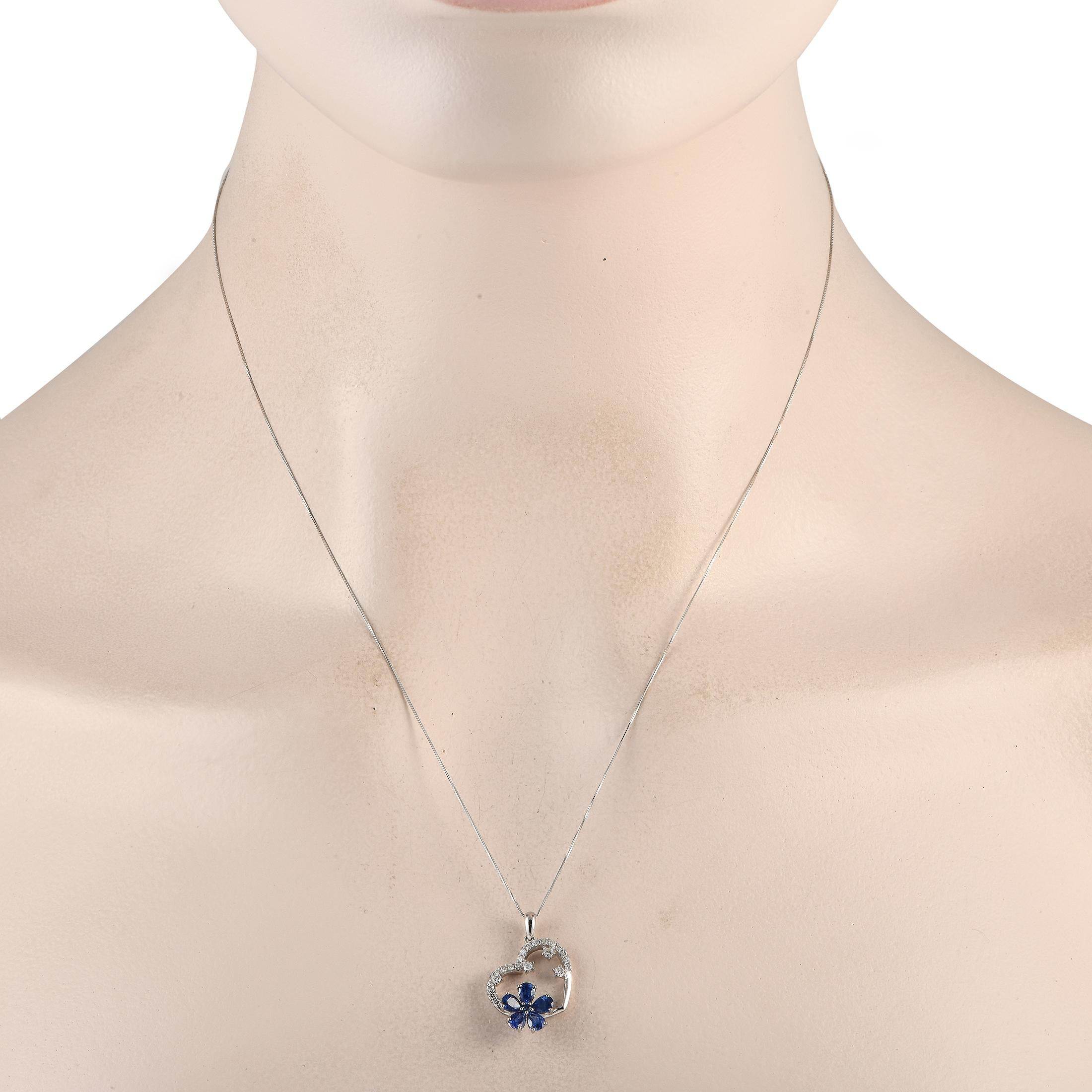 This 14K White Gold necklace is as charming as it is luxurious. Suspended from an 18 chain, youll find a heart shaped pendant measuring 0.85 long by 0.65 wide. Sapphire gemstones come together to create a fabulous floral accent, while Diamonds