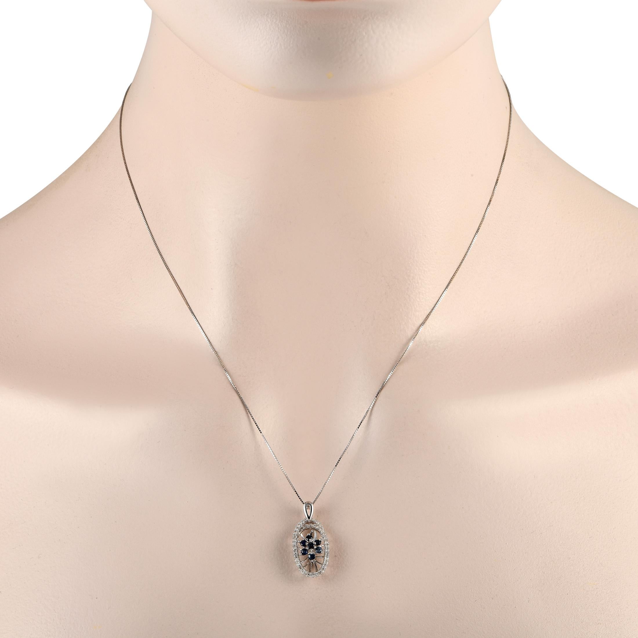 Showcase your edgy yet elegant style with this LB Exclusive necklace. It has an 18-long white gold chain and an oval open-worked pendant. The pendant's edges are traced with diamonds, while its center has a web-like structure punctuated by sapphires