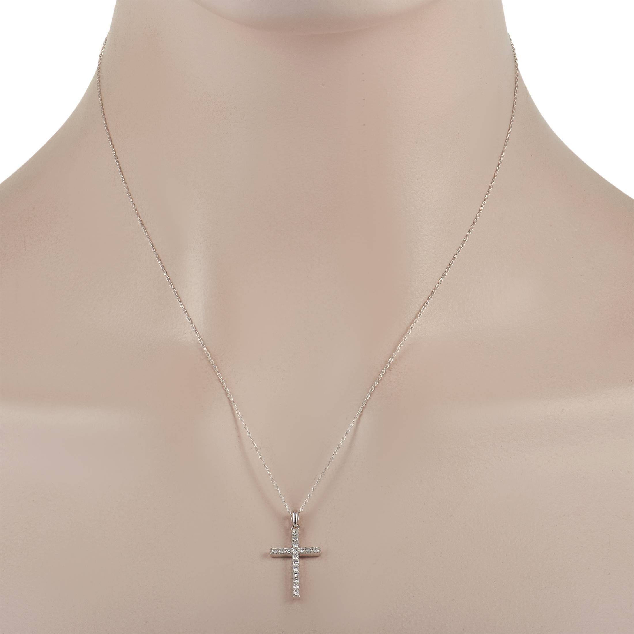 This necklace is an elegant symbol of faith that is ideal for everyday wear. Suspended from an 18” chain, you’ll find a sleek 14K White Gold cross shaped pendant that measures 1” long and 0.5” wide. Diamonds with a total weight of 0.23 carats ensure