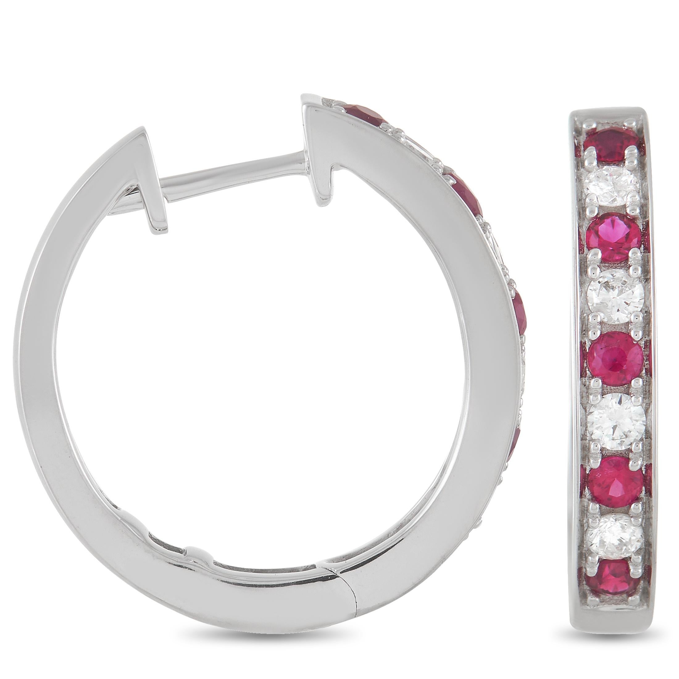 These lovely LB Exclusive 14K White Gold 0.25 ct Diamond 0.42 ct Ruby Hoop Earrings are made with 14K white gold and are set with 0.25 carats of round-cut diamonds and 0.42 carats of round cut rubies set in a single row along the face of each hoop.