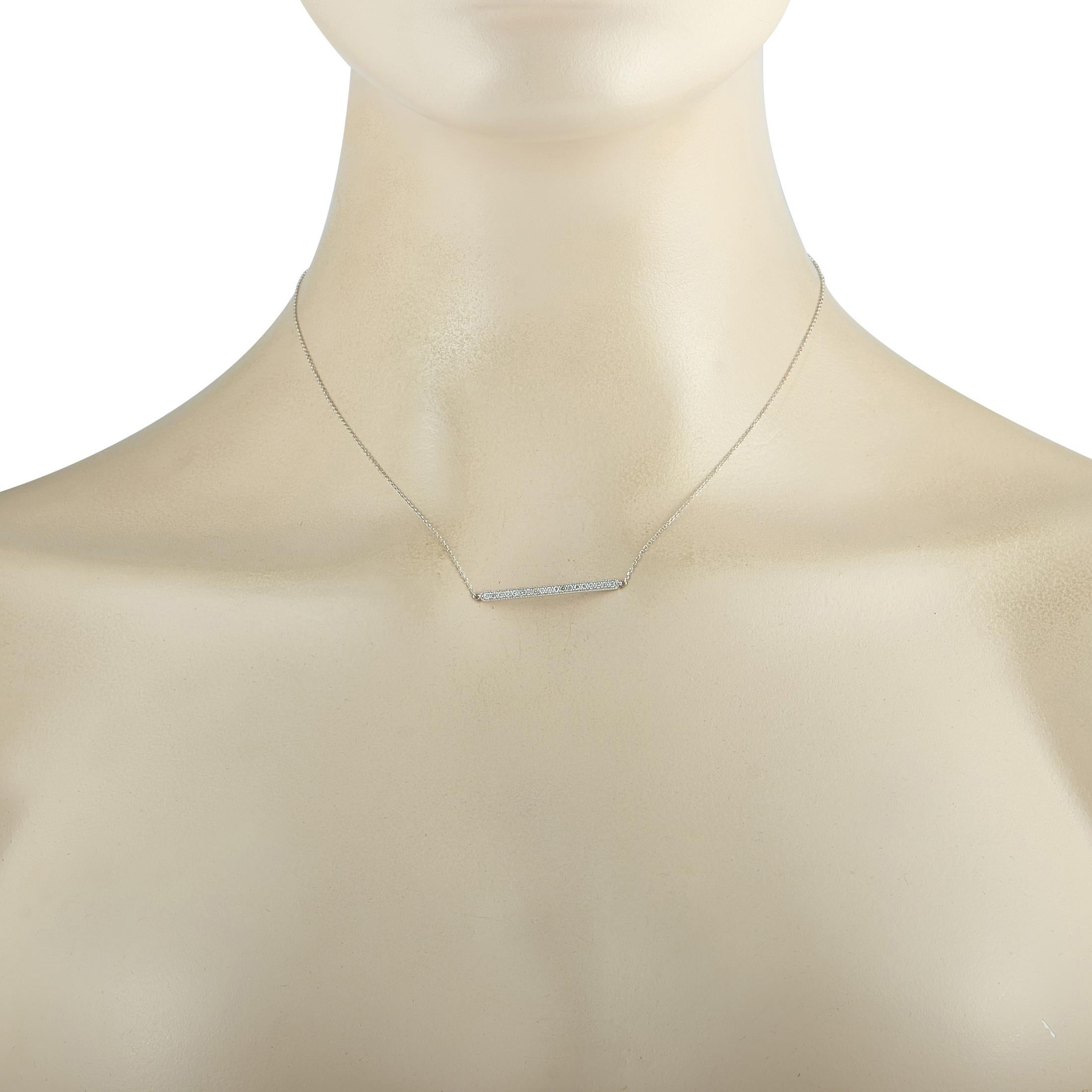 This LB Exclusive necklace is made of 14K white gold and embellished with diamonds that amount to 0.25 carats. The necklace weighs 2 grams and boasts a 15” chain and a pendant that measures 0.80” in length and 1.25” in width.
 
 Offered in brand new