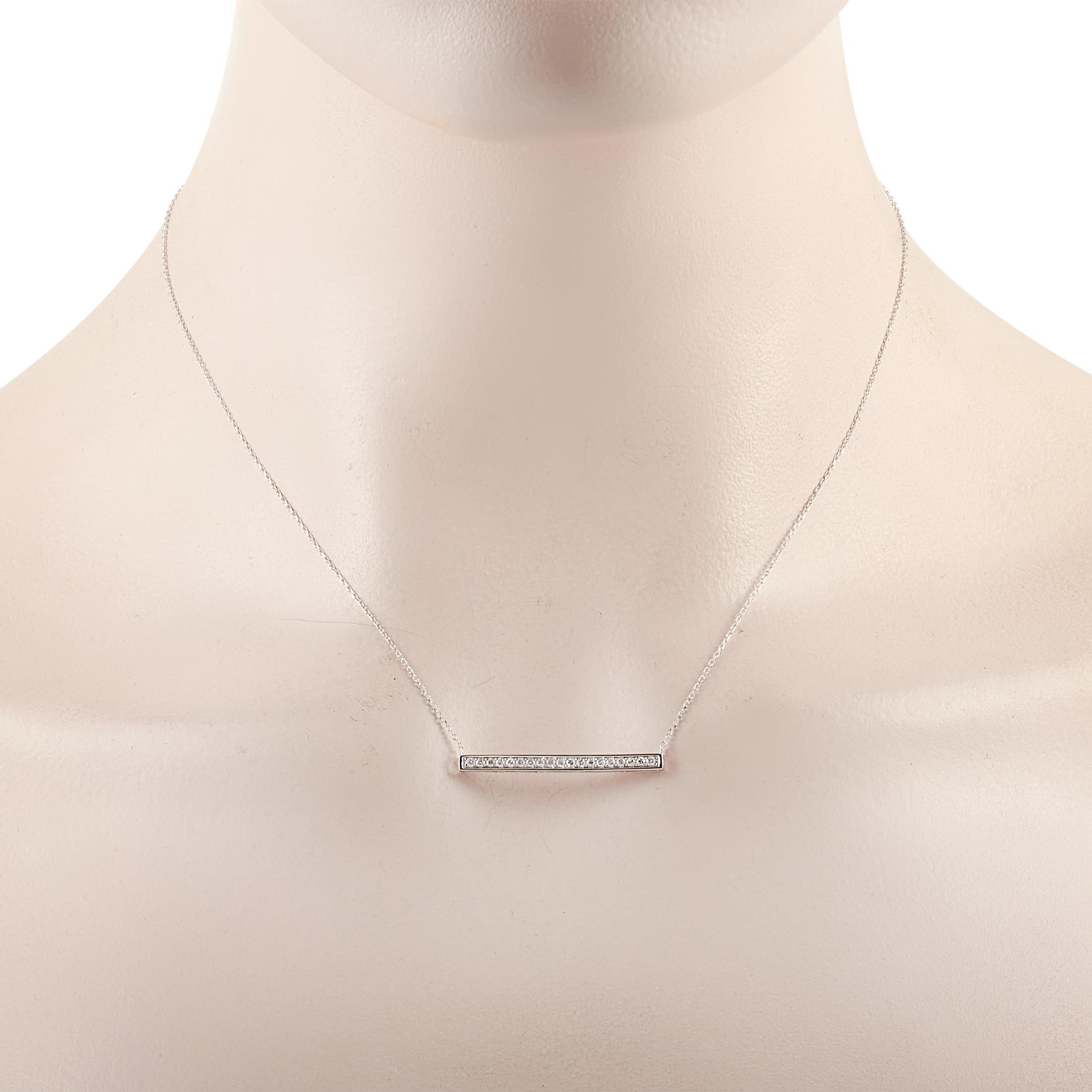 This LB Exclusive necklace is made of 14K white gold and embellished with diamonds that amount to 0.25 carats. The necklace weighs 2.1 grams and boasts a 15” chain and a pendant that measures 0.13” in length and 1.25” in width.
 
 Offered in brand