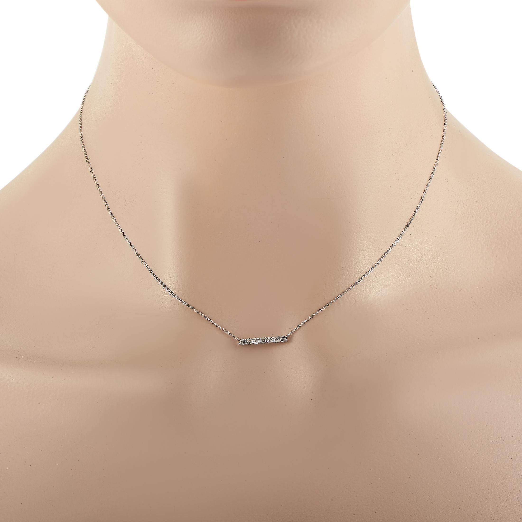 This LB Exclusive necklace is made of 14K white gold and embellished with diamonds that amount to 0.25 carats. The necklace weighs 1.4 grams and boasts a 16” chain and a pendant that measures 0.15” in length and 0.65” in width.
 
 Offered in brand