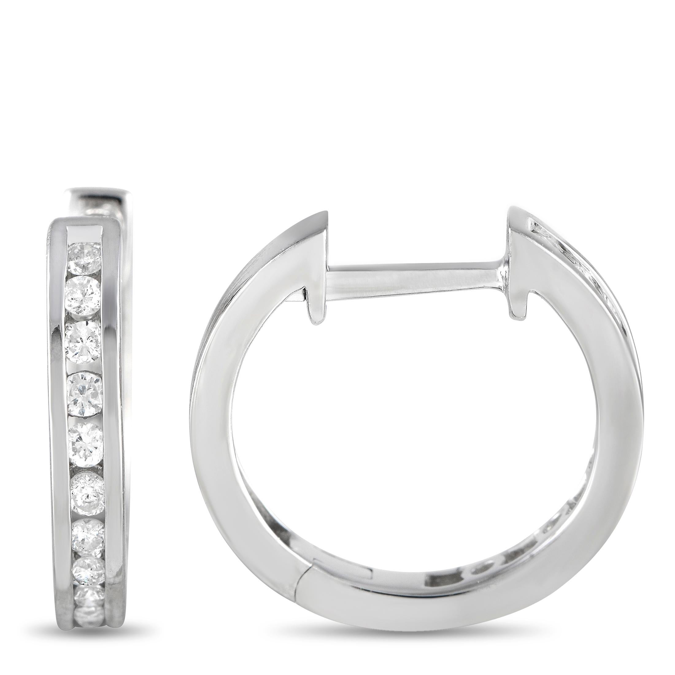 Channel-set diamonds with a total weight of 0.25 carats make these sleek, sophisticated hoop earrings shine to life every time they catch the light. Each one is crafted from 14K White Gold and measures .60” round. 

This jewelry piece is offered in