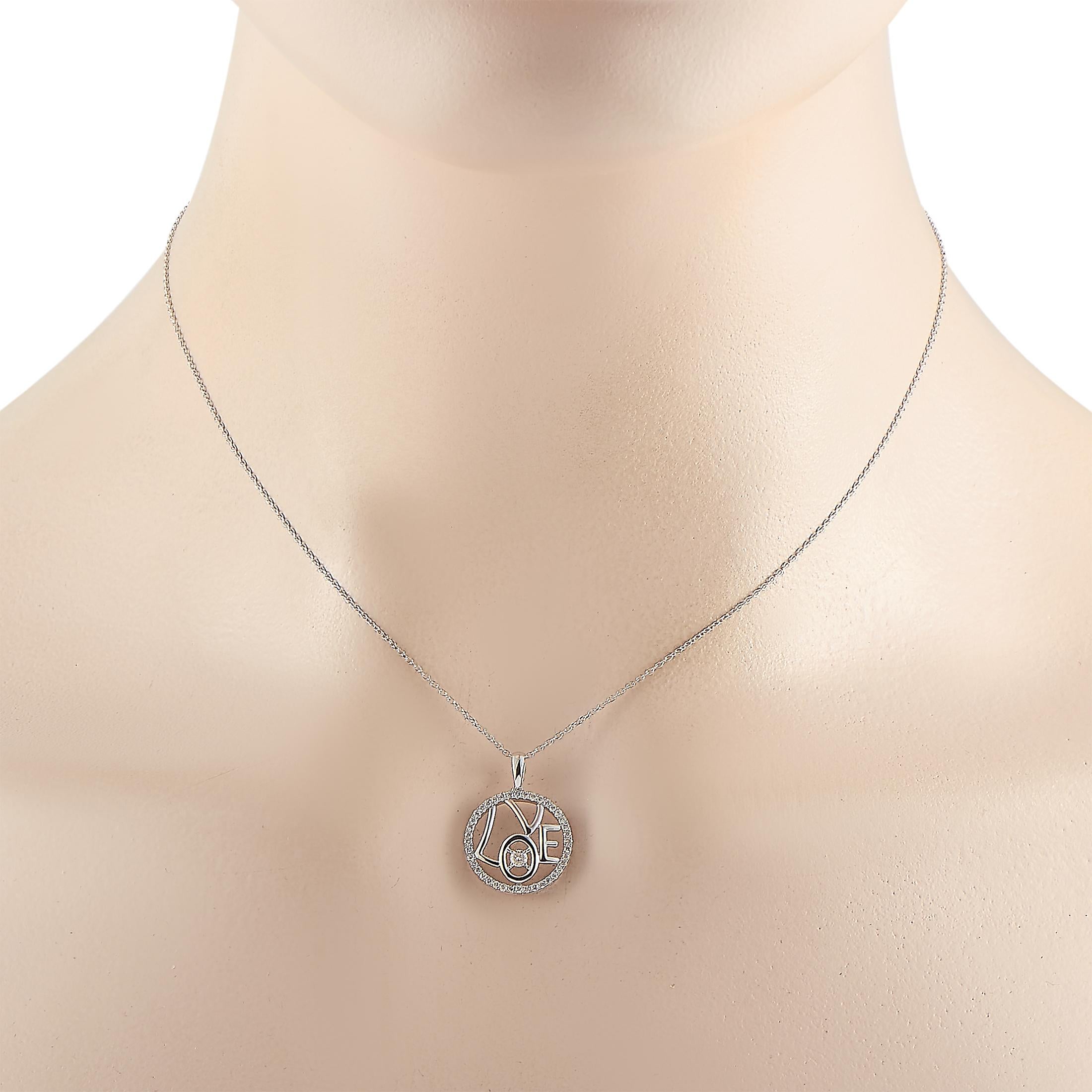 This LB Exclusive necklace is crafted from 14K white gold and weighs 2.2 grams. It is presented with a 16” chain and boasts a pendant that measures 0.75” in length and 0.65” in width. The necklace is set with diamonds that total 0.30 carats.
 

