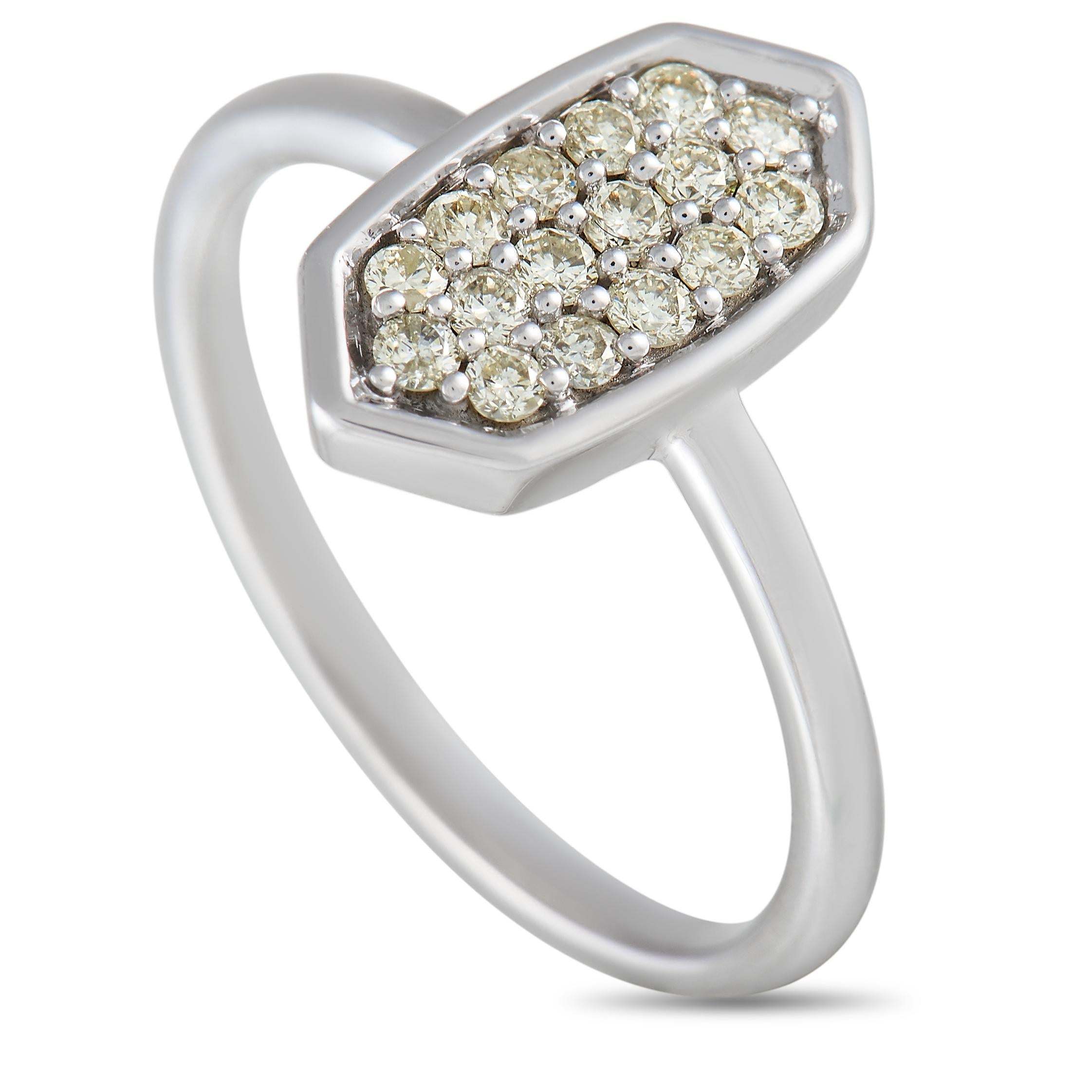 Sleek and modern in design, there’s something special about this scintillating luxury ring. At the center of the 1mm wide band, you’ll find a striking geometric motif that elegantly displays inset diamonds totaling 0.31 carats. This piece is crafted