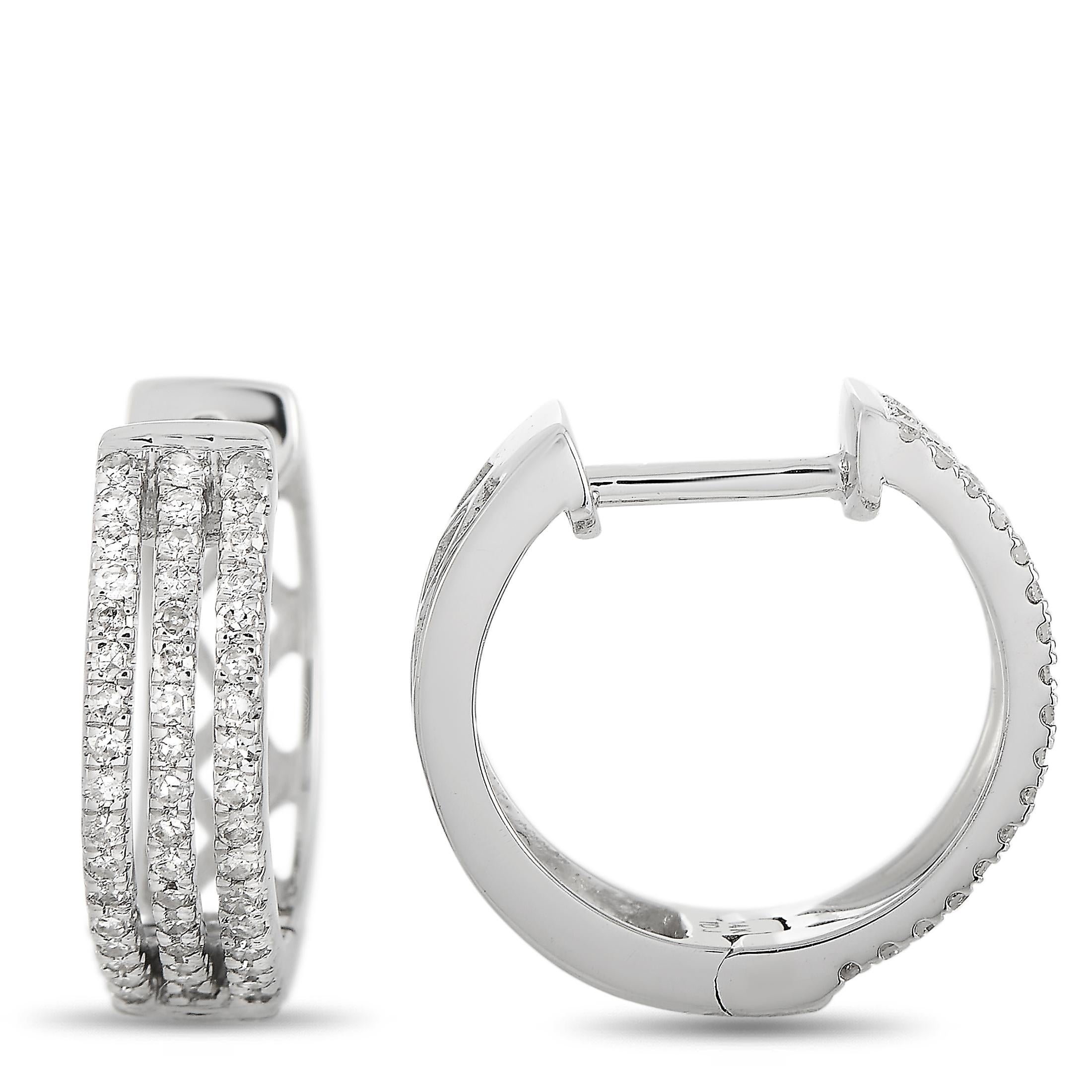 These LB Exclusive hoop earrings are made of 14K white gold and embellished with diamonds that amount to 0.33 carats. The earrings measure 0.50” in length and 0.20” in width, and each of the two weighs 1.15 grams.
 
 The pair is offered in brand