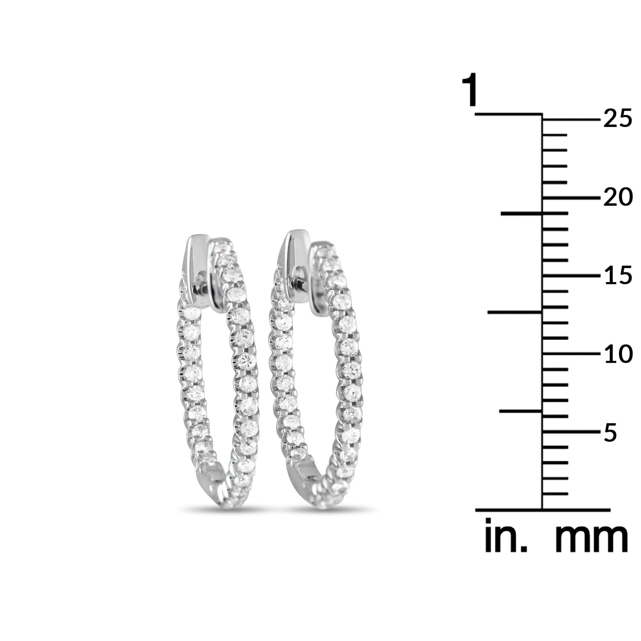 Diamonds totaling 0.42 carats located at both the front and rear of these hoop earrings allow them to sparkle from seemingly every angle. Stylish and incredibly refined, each one features a 14K White Gold setting that measures 0.70” round. 
 
 This