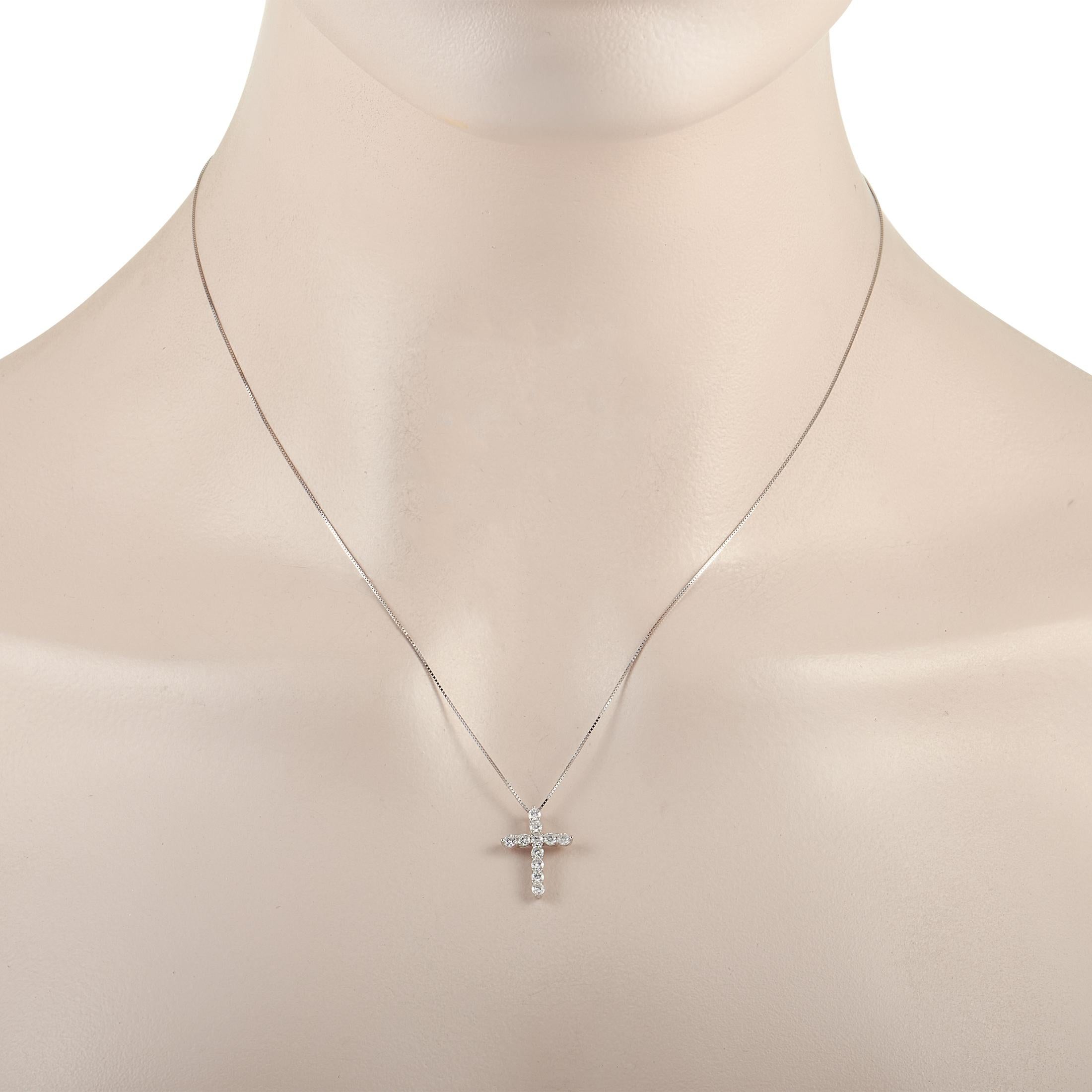 This lovely LB Exclusive 14K White Gold 0.44 ct Diamond Cross Necklace is made with an 14K white gold chain and features a white gold cross pendant set with 0.44 carats of round cut diamonds. The delicate 14K white gold chain measures 17.5 inches in