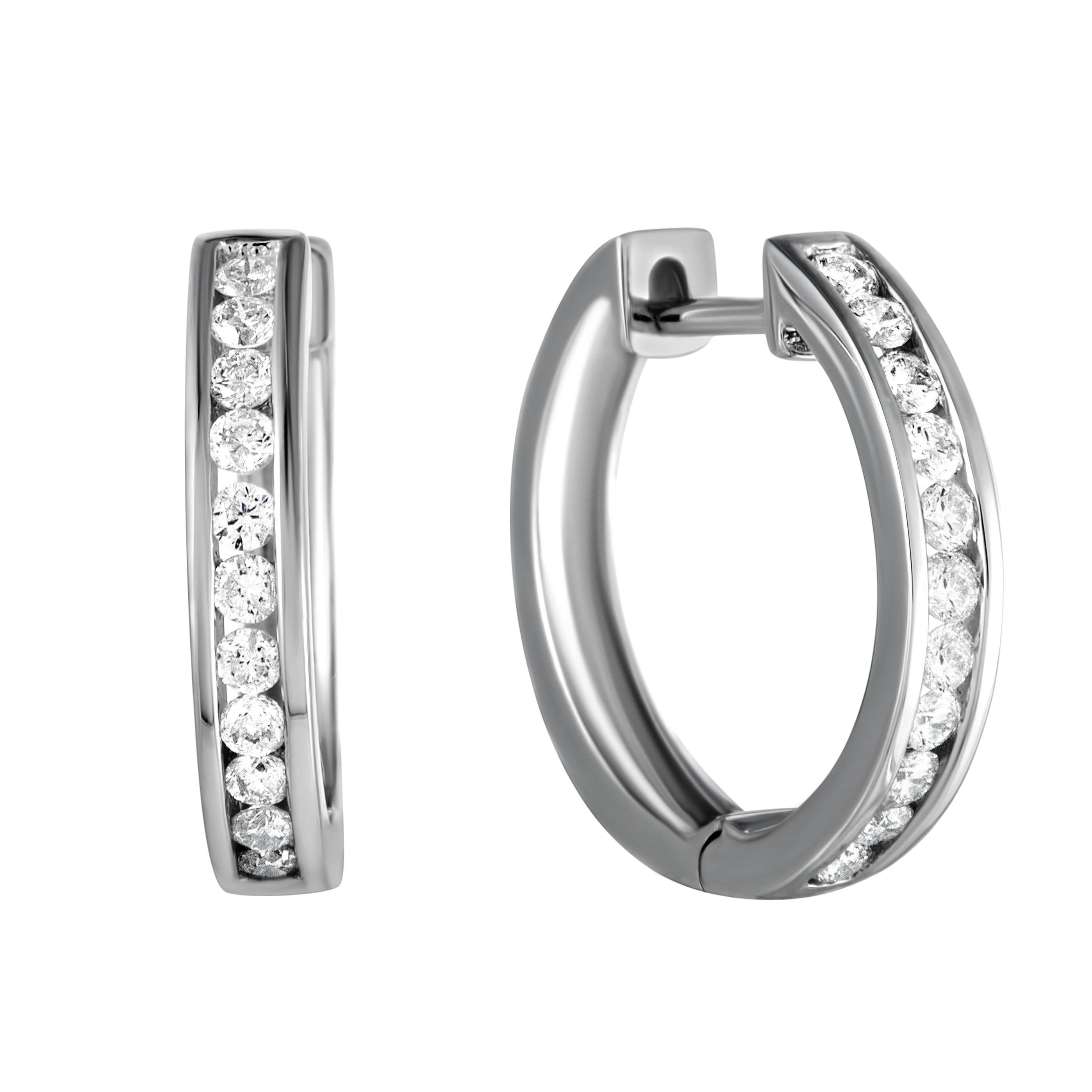 Exceptionally stylish, charmingly feminine and remarkably understated, these wonderful earrings are made of gracefully shaped 14K white gold which is lined with lustrous diamonds amounting to 0.50ct for a stunning effect.