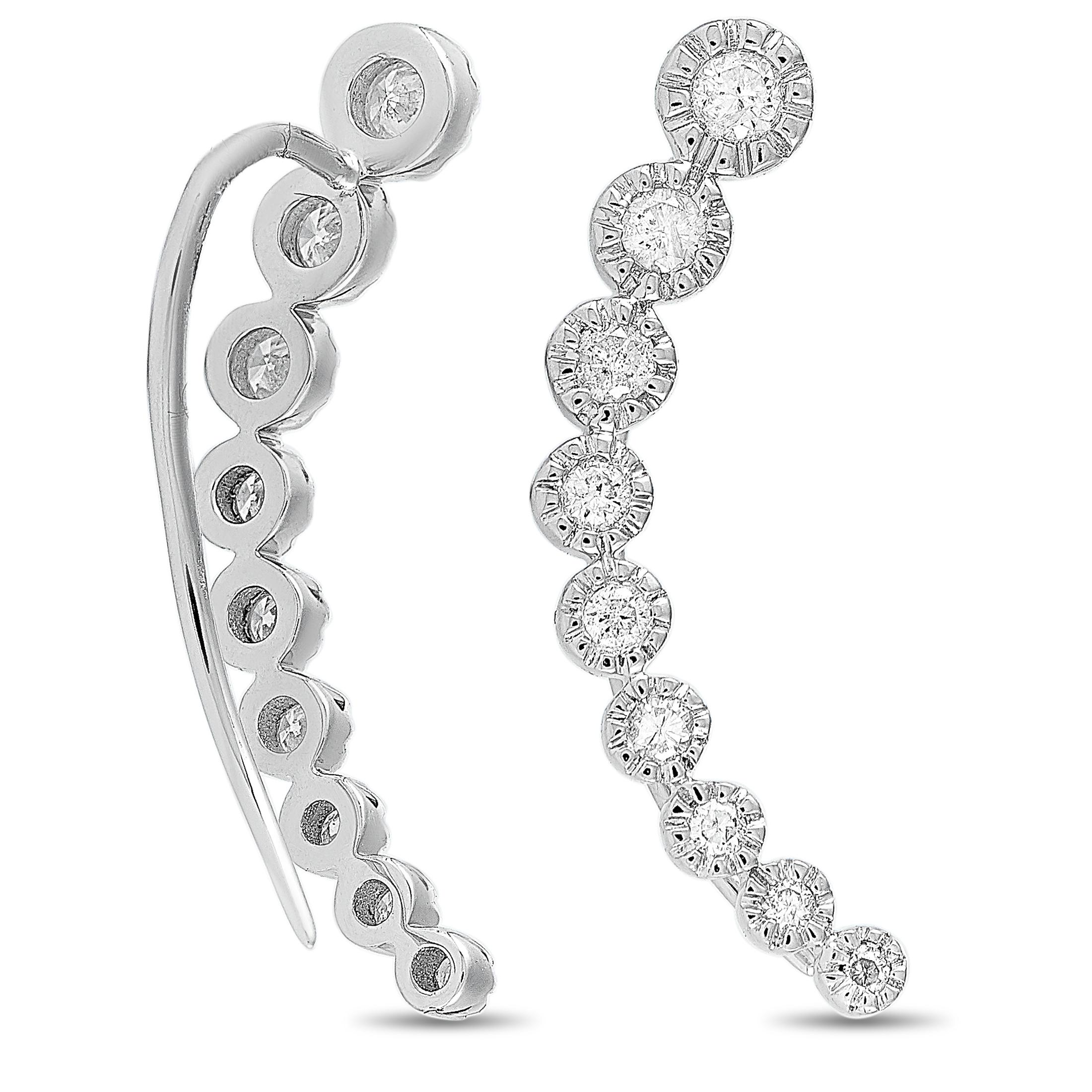 These LB Exclusive climber earrings are made of 14K white gold and embellished with diamonds that amount to 0.50 carats. The earrings measure 1” in length and 0.15” in width, and each of the two weighs 1.35 grams.
 
 The pair is offered in brand new