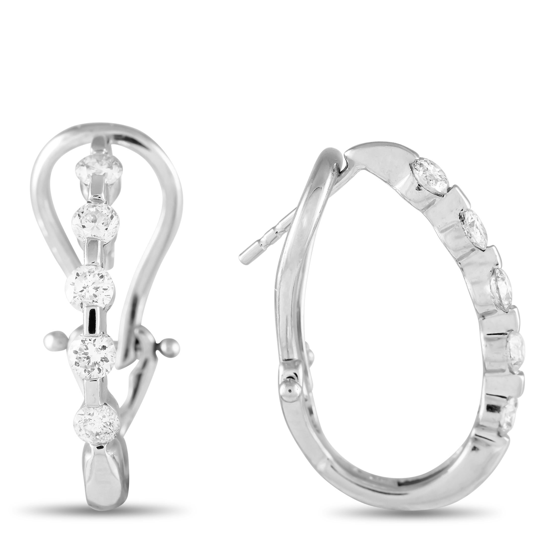 A delicate 14K White Gold setting provides the perfect foundation for these exquisite earrings. Special enough for any occasion, each one measures 1.0 long by 0.65 wide. Together, they showcase sparkling Diamonds with a total weight of 0.50