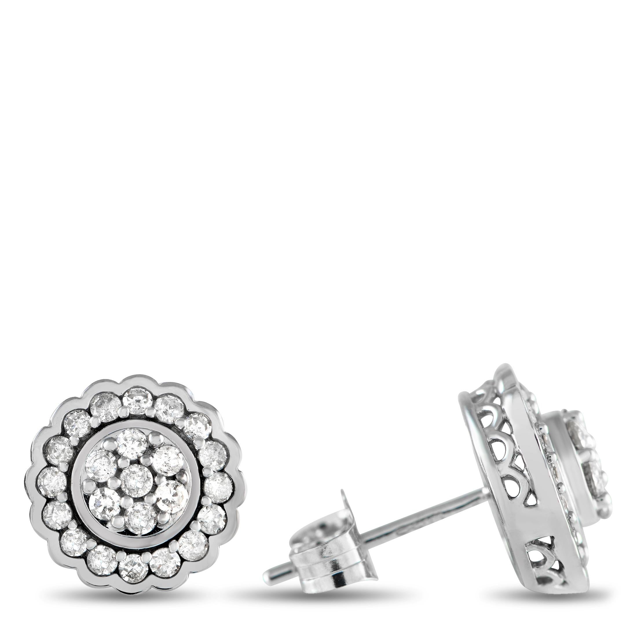 Gorgeous and timeless, these floral-inspired earrings pair beautifully with any outfit. They are made of 14K white gold and feature a scalloped outline filled with round diamonds, as well as a round bezel center encrusted with additional round
