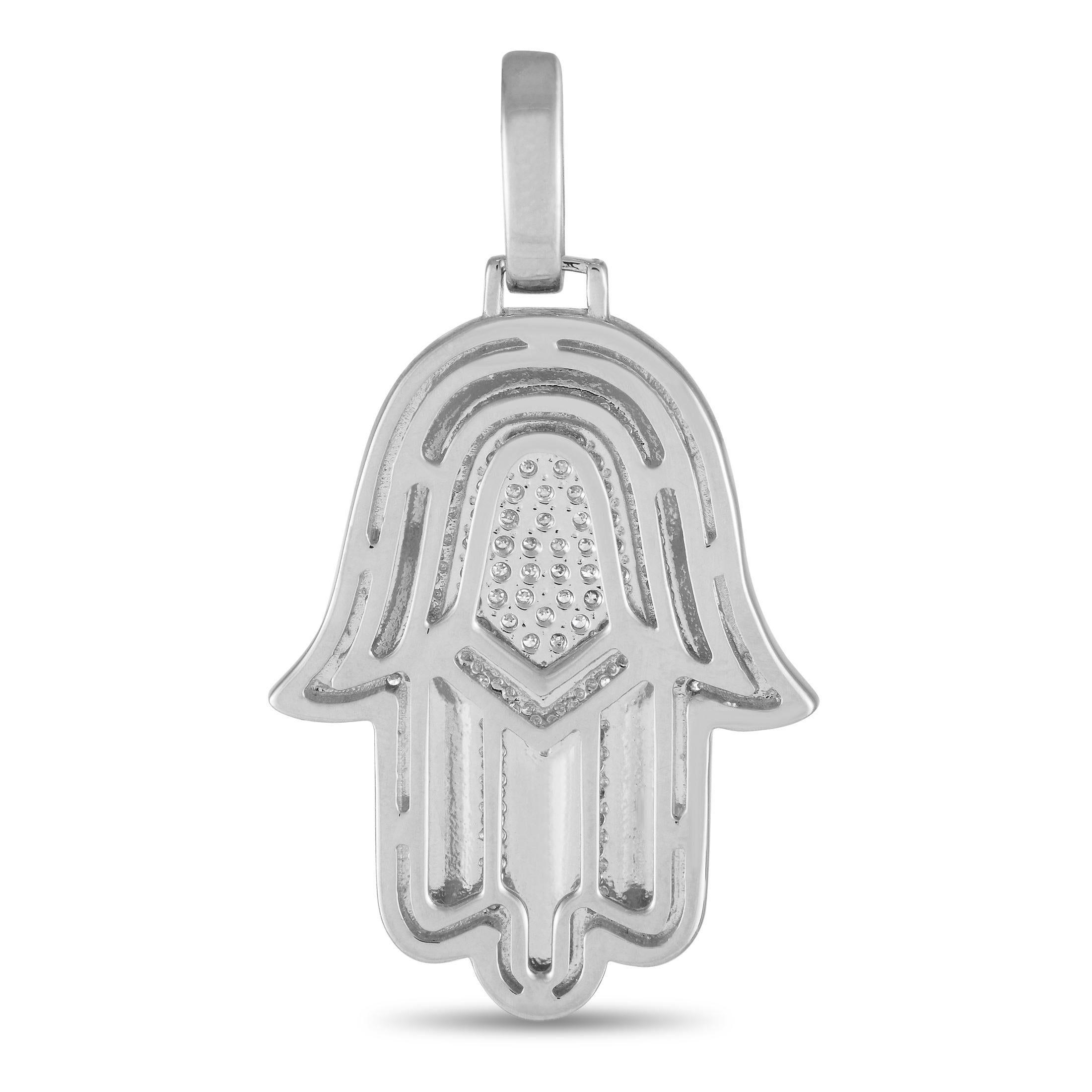 The traditional Hamsa symbol comes to life on this luxurious 14K white gold pendant. Simple, elegant, and statement-making, it measures 1.45 long, 0.75 wide, and is elevated by sparkling diamonds totaling 0.50 carats.This jewelry piece is offered in
