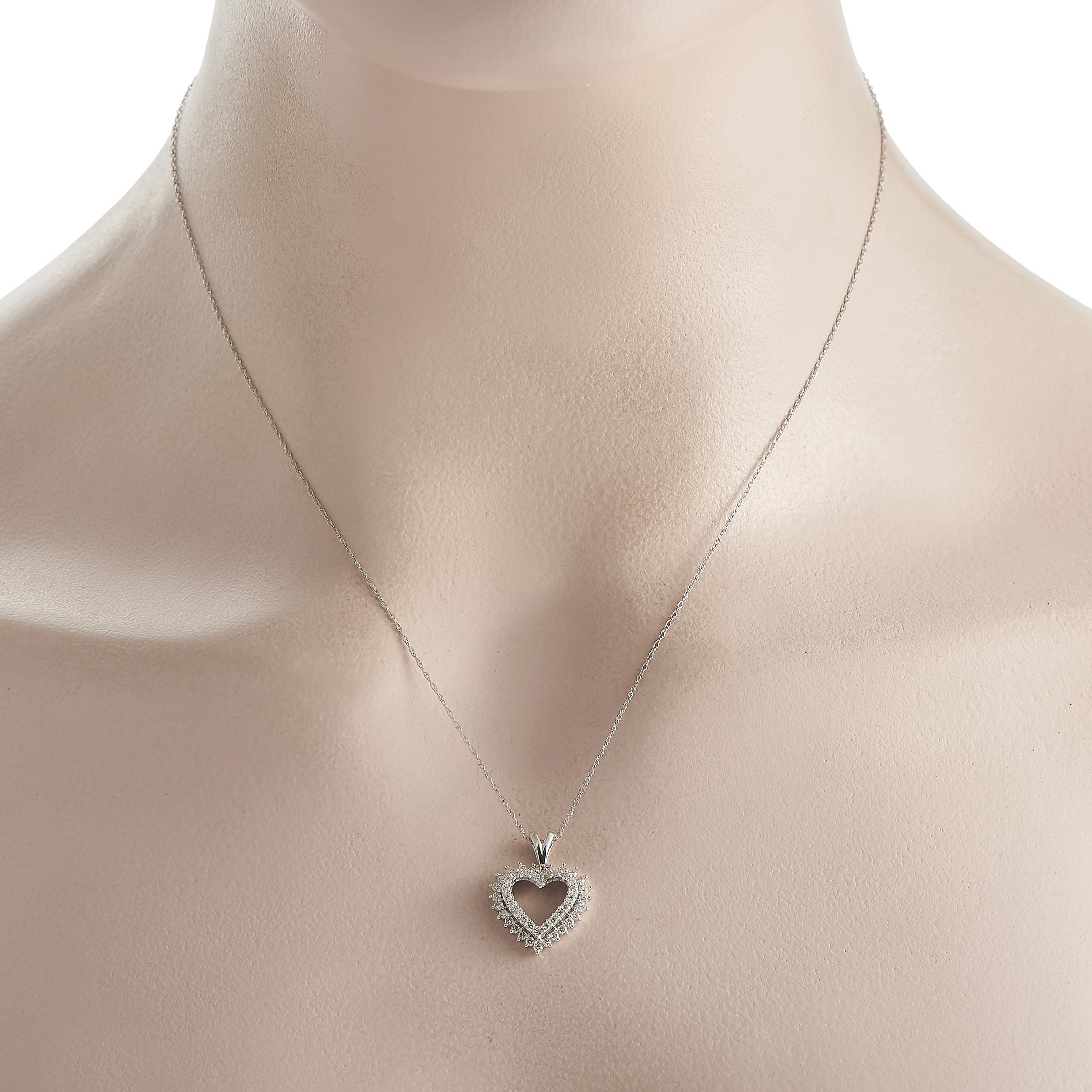 A dainty piece of jewelry that makes a lovely gift. This necklace features a 14K white gold heart-shaped pendant with an open silhouette. The 0.75