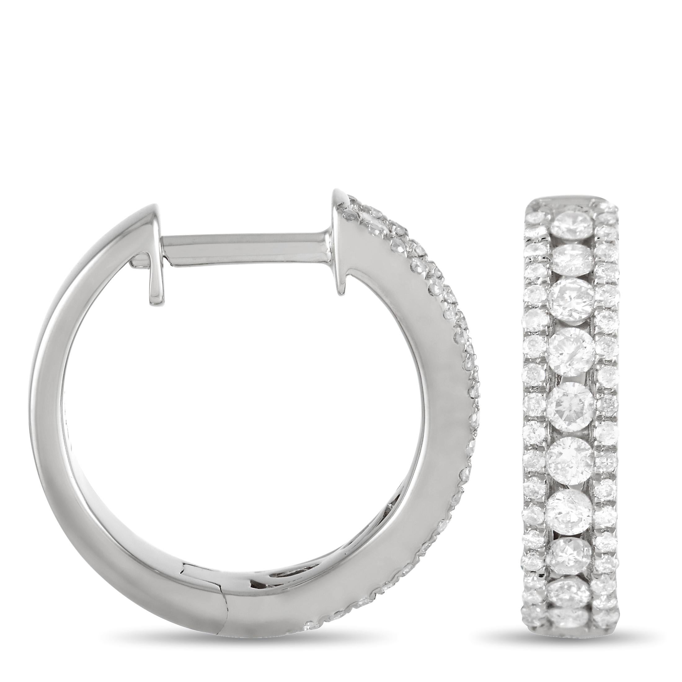 A timeless pairing of 14K white gold and shimmering diamonds make these earrings simply exquisite. Each one measures 0.5” round and showcases three rows of diamonds, which together possess a total weight of 0.50 carats. 

This jewelry piece is