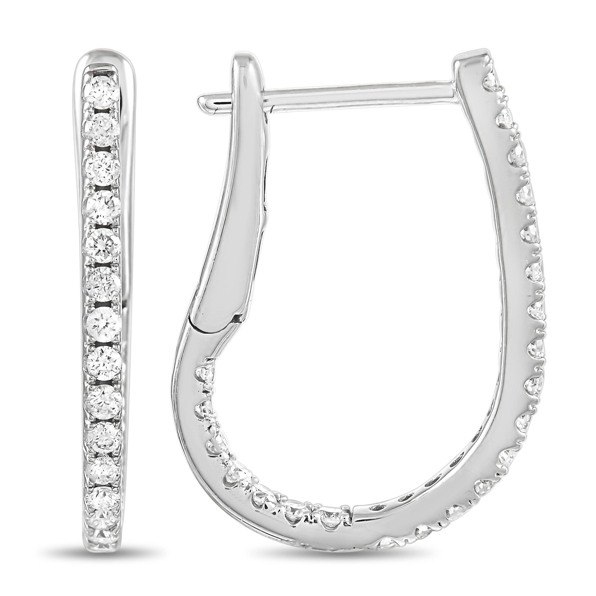 These sleek, sophisticated earrings will beautifully complement any ensemble. The understated 14K White Gold setting pairs perfectly with the stunning array of diamonds, which possess a total weight of 0.51 carats. Each earring measures 0.75” long