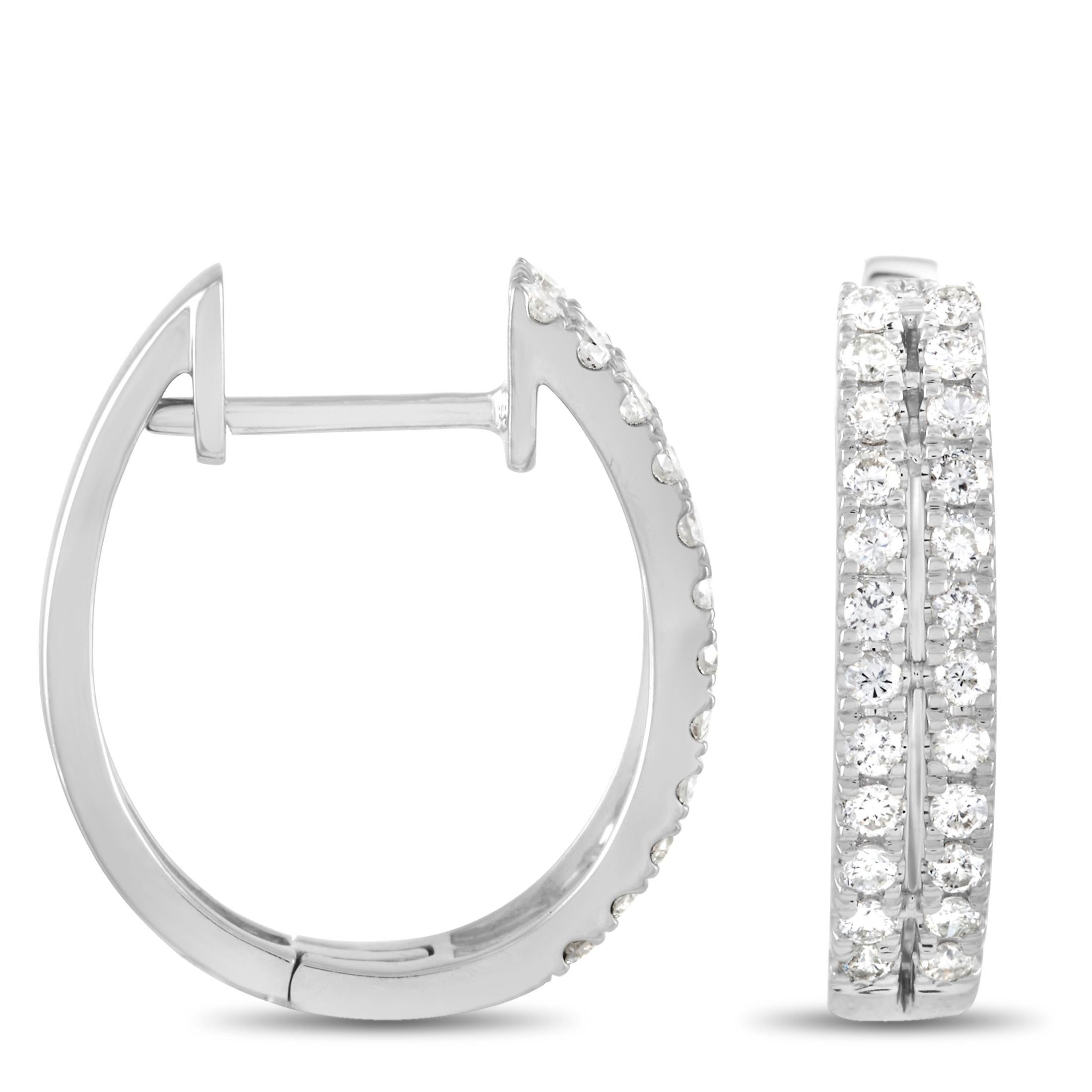 These LB Exclusive 14K White Gold 0.53 ct Diamond Hinged Hoop Earrings are made of 14K White Gold and set with 0.53 carats of round cut diamonds in two rows around the hoop. The earrings measure 0.56 inches in length and 0.57 inches in width with