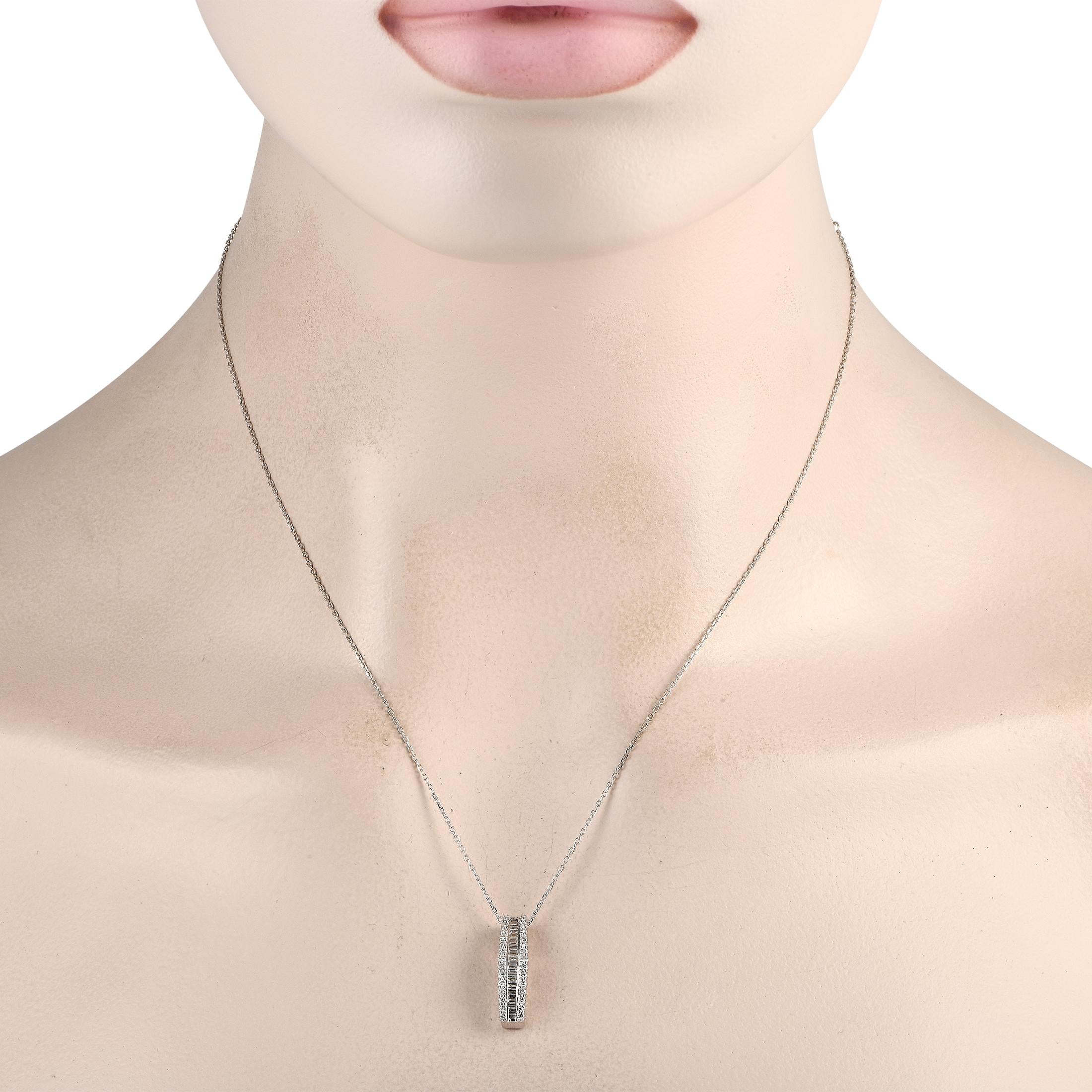 A series of step-cut and round-cut diamonds with a total weight of 0.58 carats elevate this simple, stylish 14K White Gold necklace. The pendant measures 0.75” long, 0.15” wide, and comes attached to a delicate 18” chain. 
 
This jewelry piece is