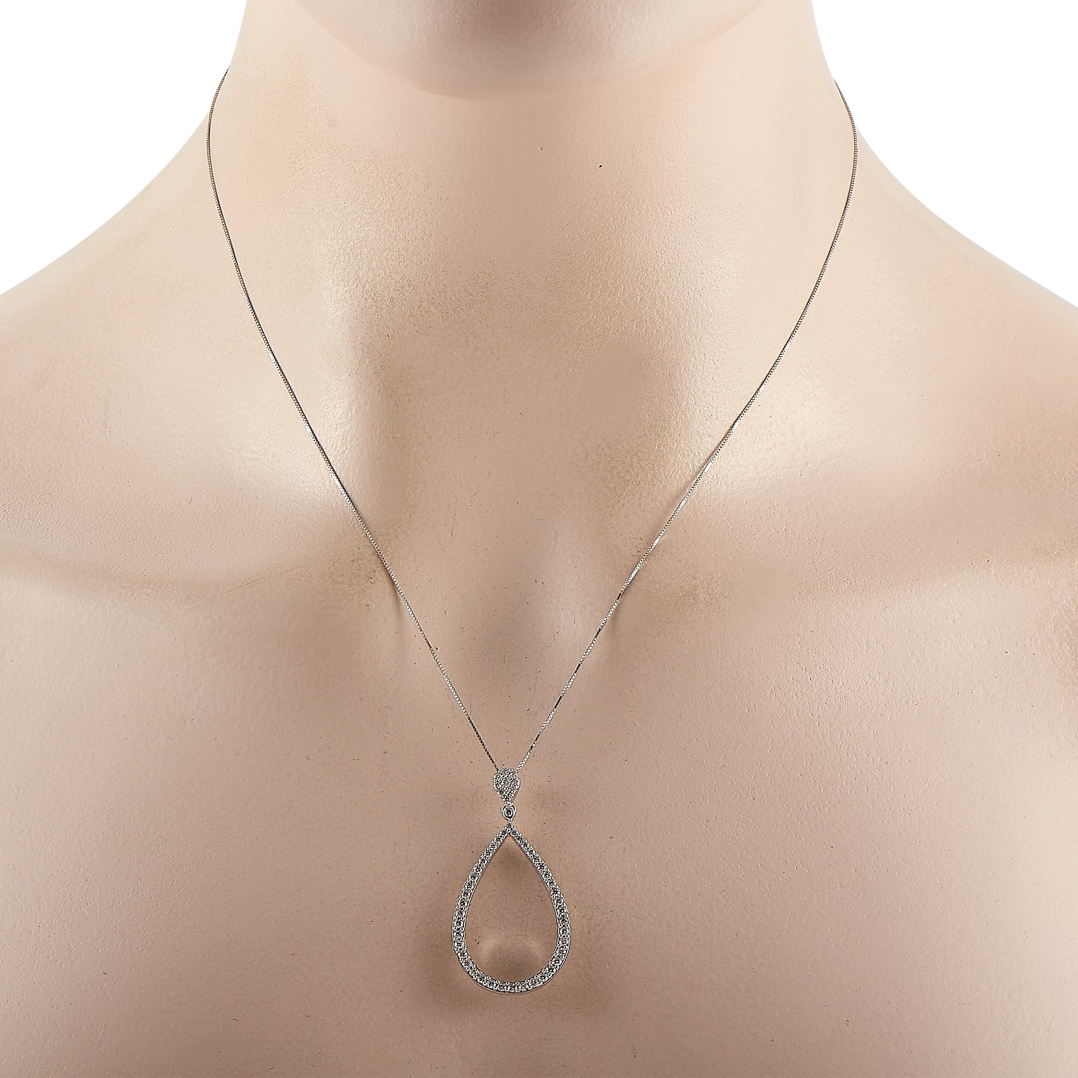 This LB Exclusive 14K White Gold 0.75 ct Diamond Teardrop Pendant Necklace features a delicate 14K White Gold chain measuring 18 inches in length. The necklace features a teardrop-shaped pendant set with 0.75 carats of round-cut diamonds. The