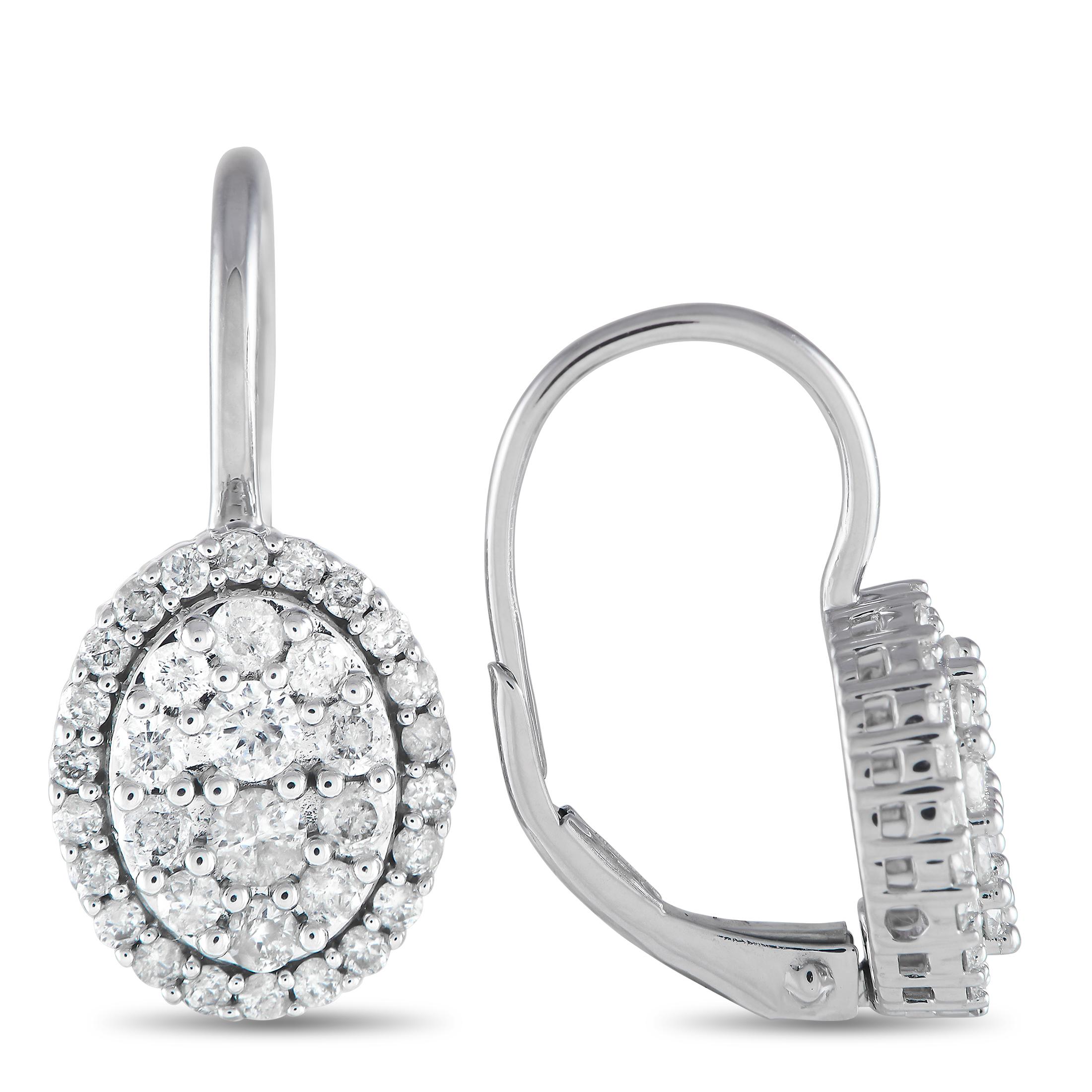 The earrings you'll now reach for when dressing up on special days. These sparklers feature an oval cluster of round diamonds secured by a leverback hook. A halo of diamonds adds to the gracefulness of these earrings. Each earring measures 0.75