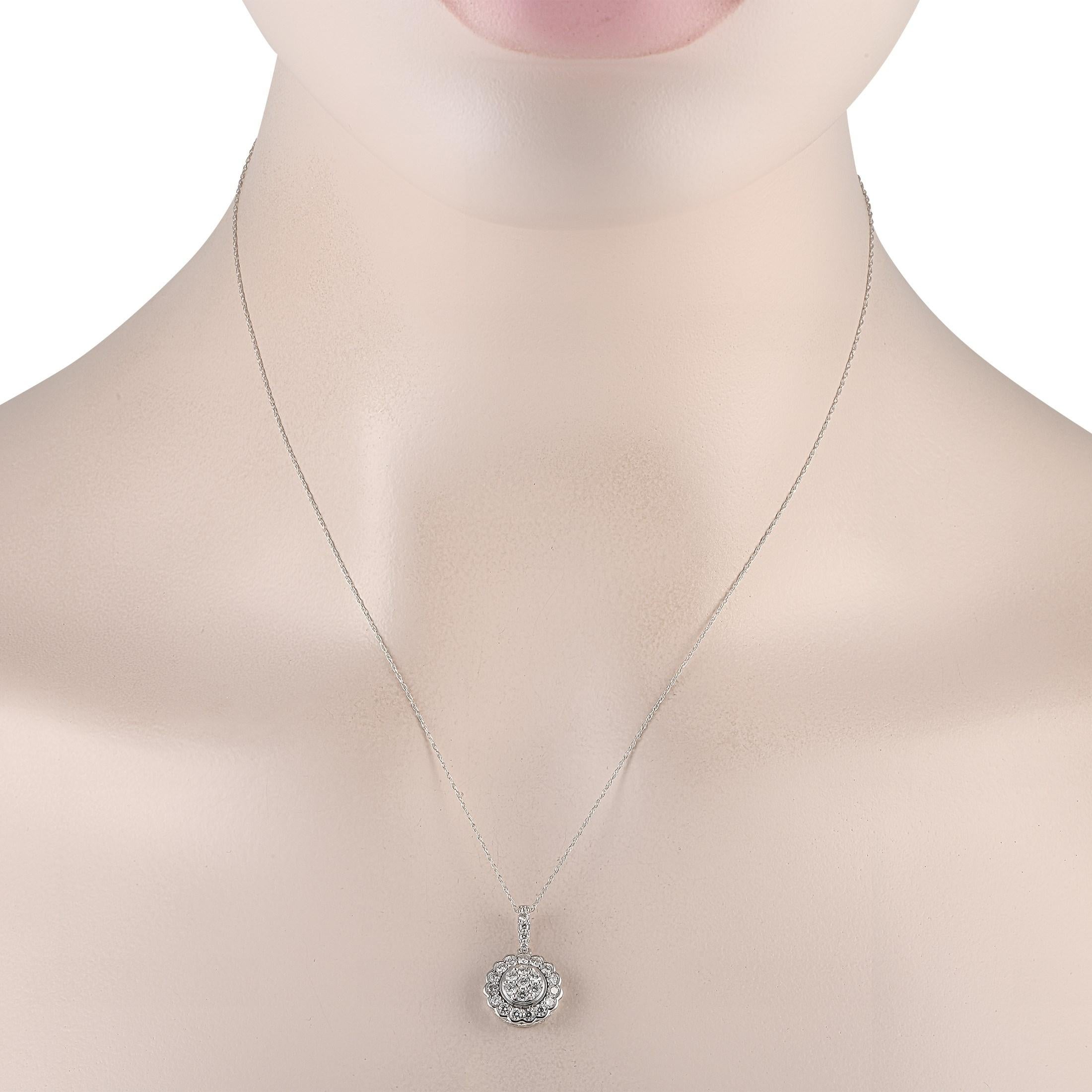 This charming stunner is perfect for all-day wear. The necklace has an 18 chain in 14K white gold fastened by a spring ring clasp. The 0.85 by 0.50 pendant features a central disc embellished with round diamonds. A floral-inspired halo dotted with