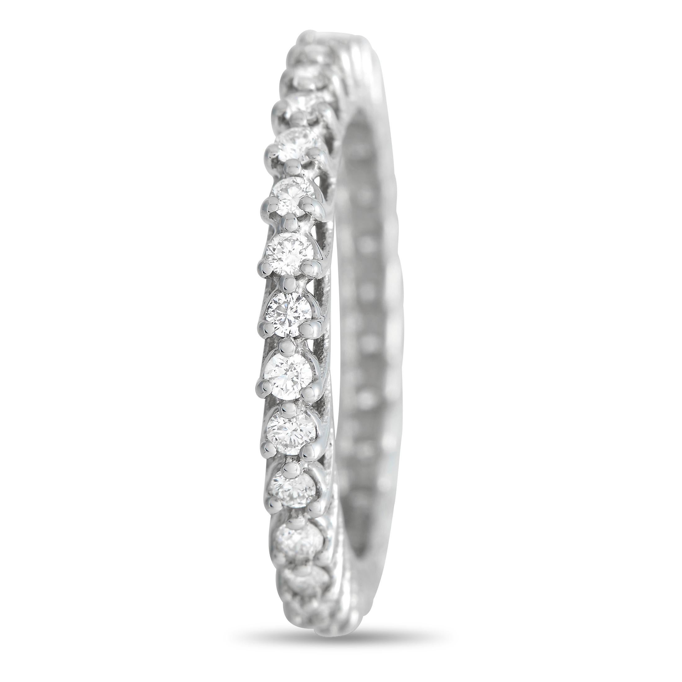 Sparkling diamonds with a total weight of 0.80 carats make this elegant 14K White Gold band ring simply unforgettable. It measures 3mm wide, making it ideal for everyday wear. 
 
 This jewelry piece is offered in brand new condition and includes a