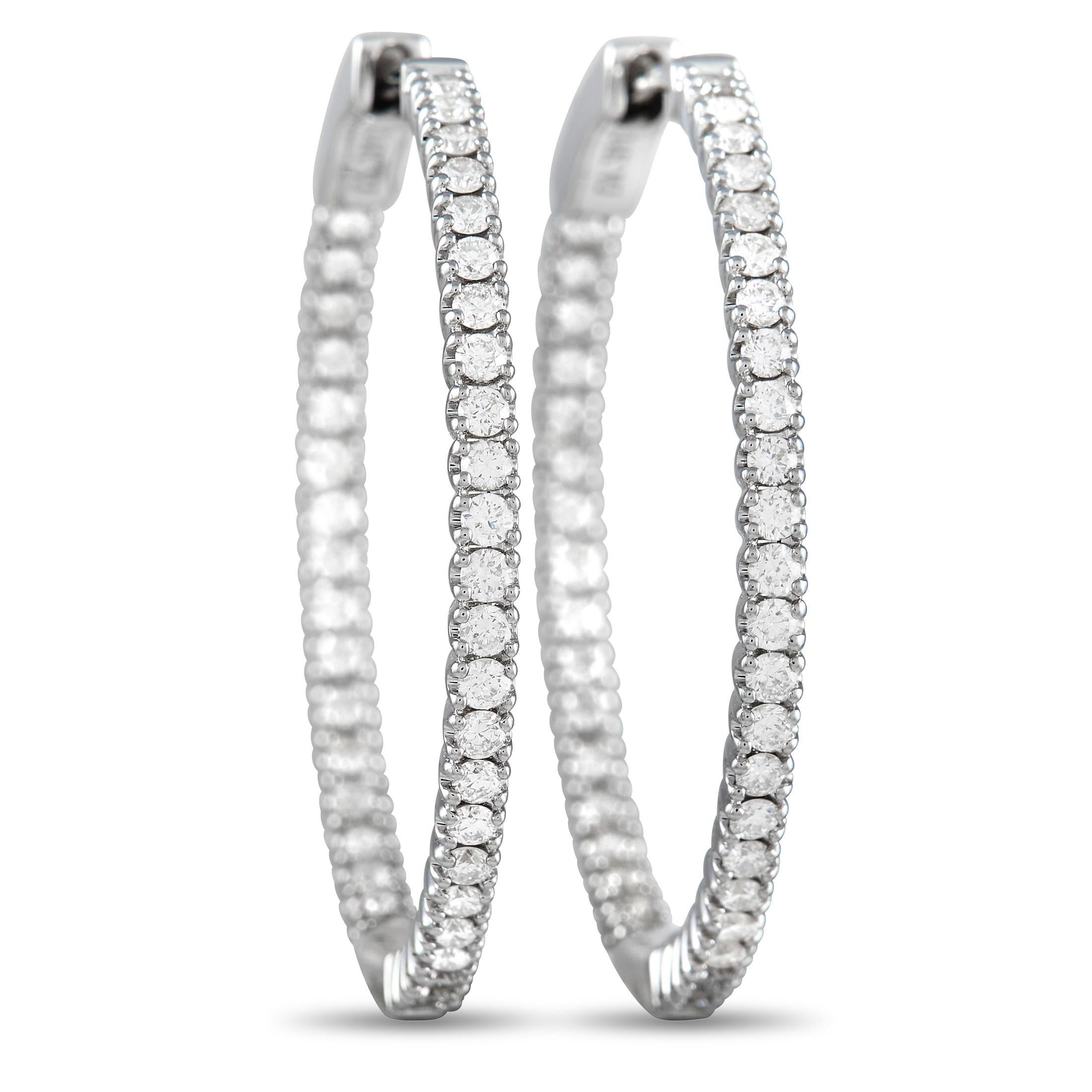 Sleek and stylish, these 14K White Gold hoop earrings will never go out of style. The minimalist design allows their 0.98 carats of sparkling inset diamonds to take center stage. Each one measures 1.15” round, making them as comfortable as they are