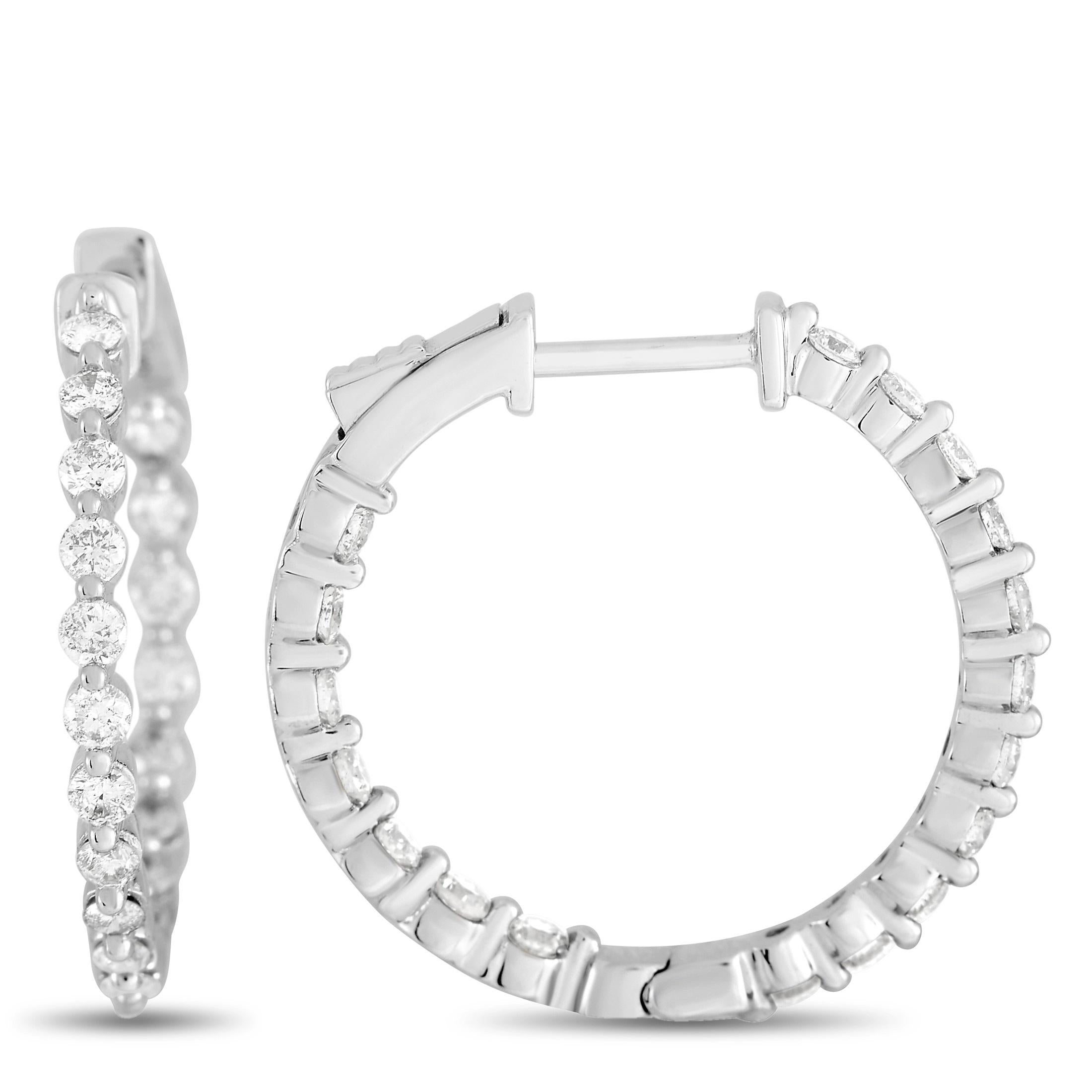 Nothing beats a classic pair of hoop earrings. Sleek and sophisticated, each one of these delicate earrings measures 0.88” round and comes complete with a 14K White Gold setting. Diamonds with a total weight of 1.0 carats ensure these always add a